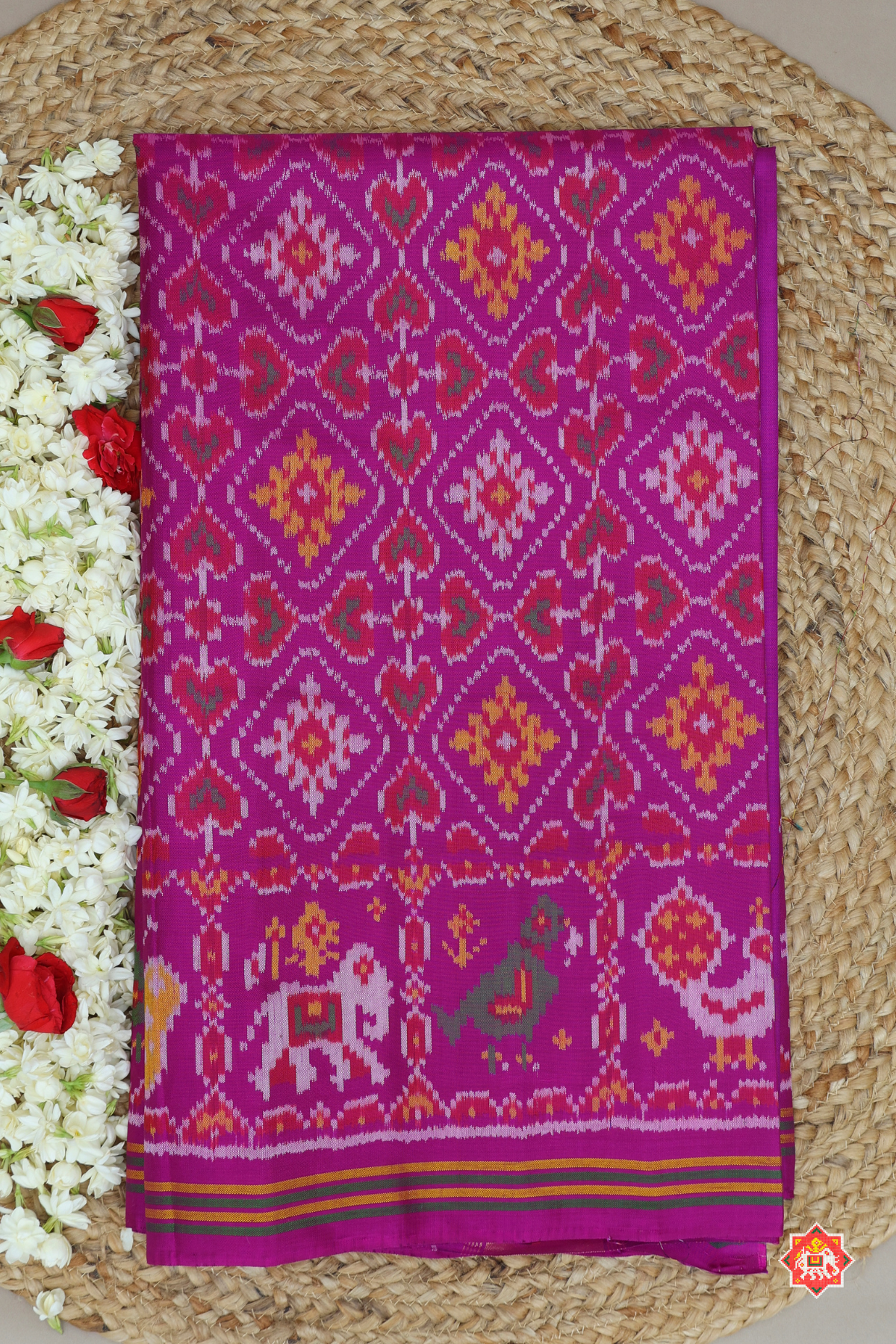 Traditional paan chnada design with motif border semi double ikat patola saree