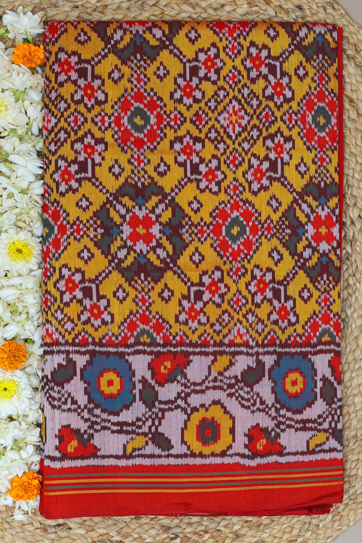Navratna design with flowers border semi double ikat patola saree