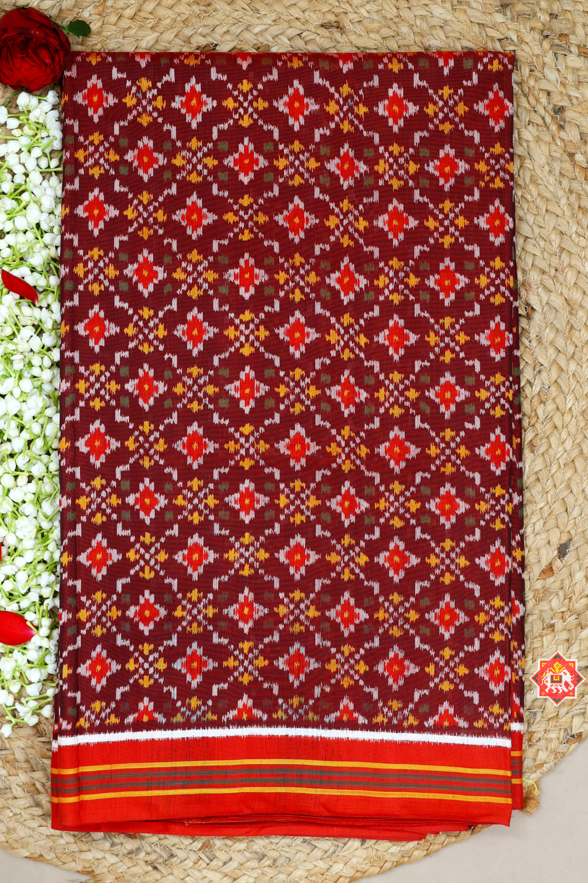 Treditional button full design small border semi double ikat patola saree