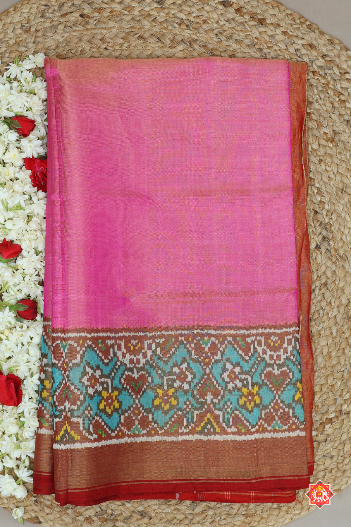 Plain pink with c-green navratna manek chowk border tissue patola saree