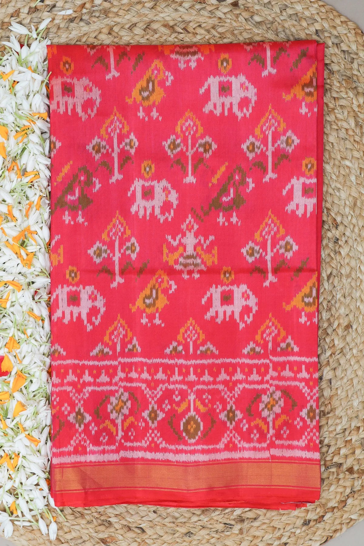Traditional motif design with small tissue border single ikat patola saree