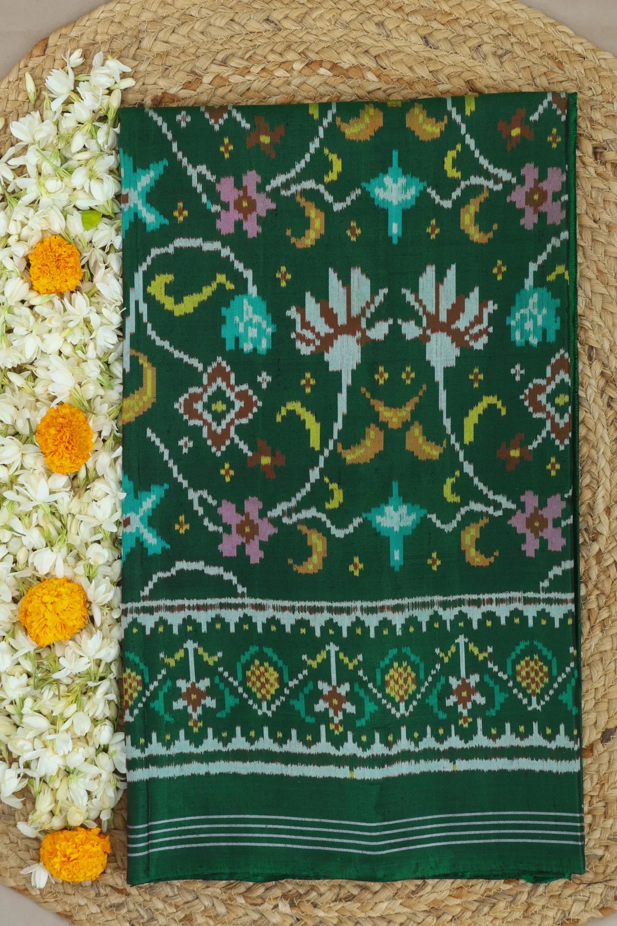 Rangoli design with pallu border traditional semi double ikat patola saree