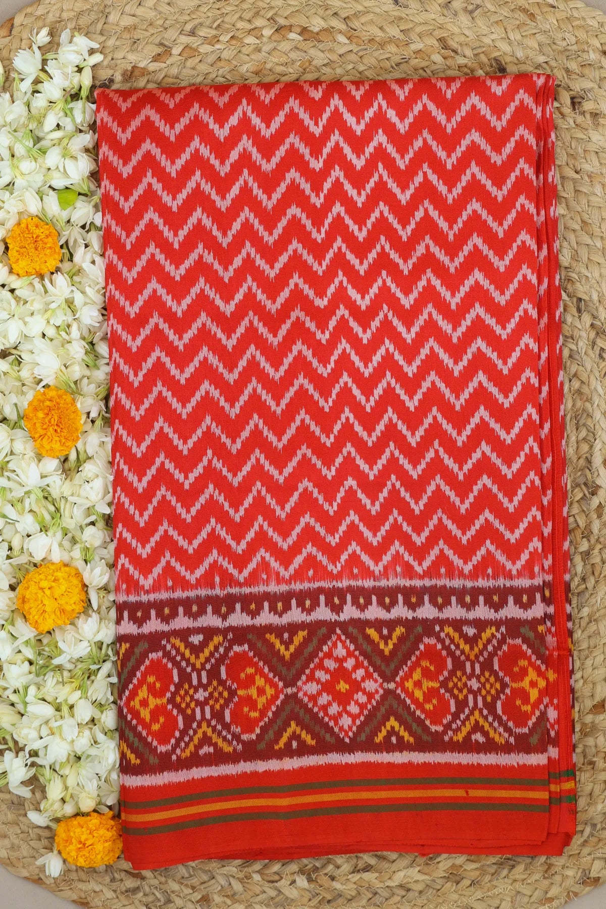 Zig-zag with pallu border flower design semi double ikat patola saree