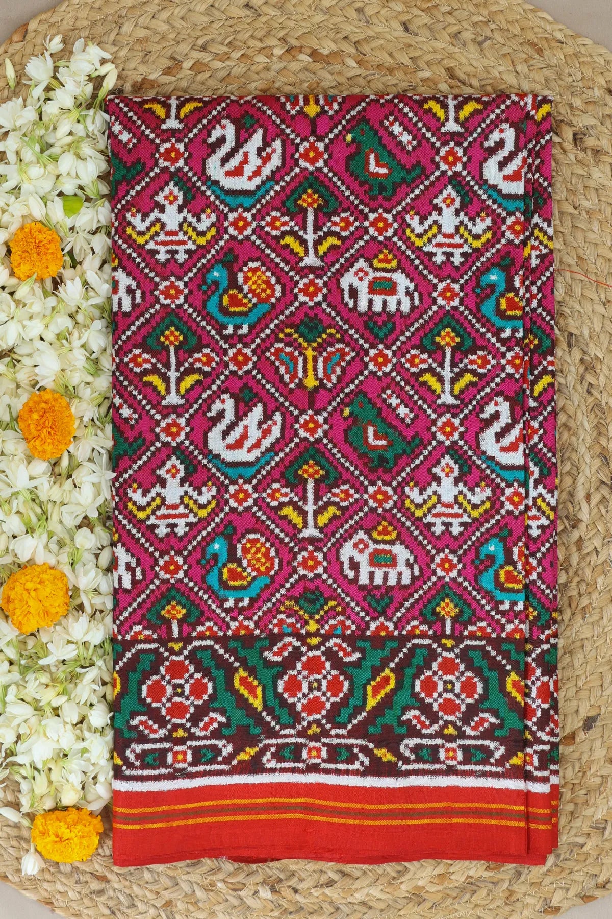 Patan patola tradtional nari kunjar with flower border pure double ikat saree