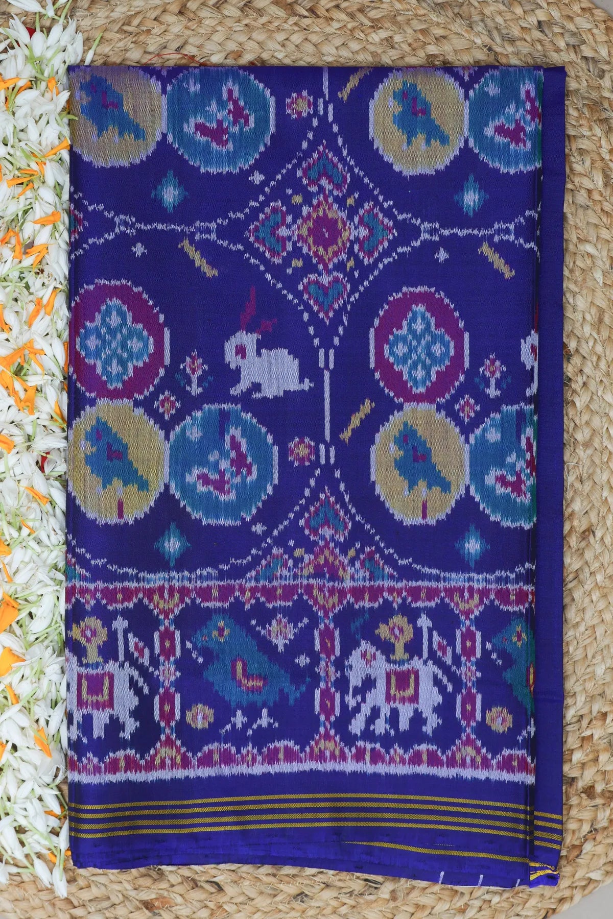 Chhabdi with motif design plain blue color semi double ikat patola saree