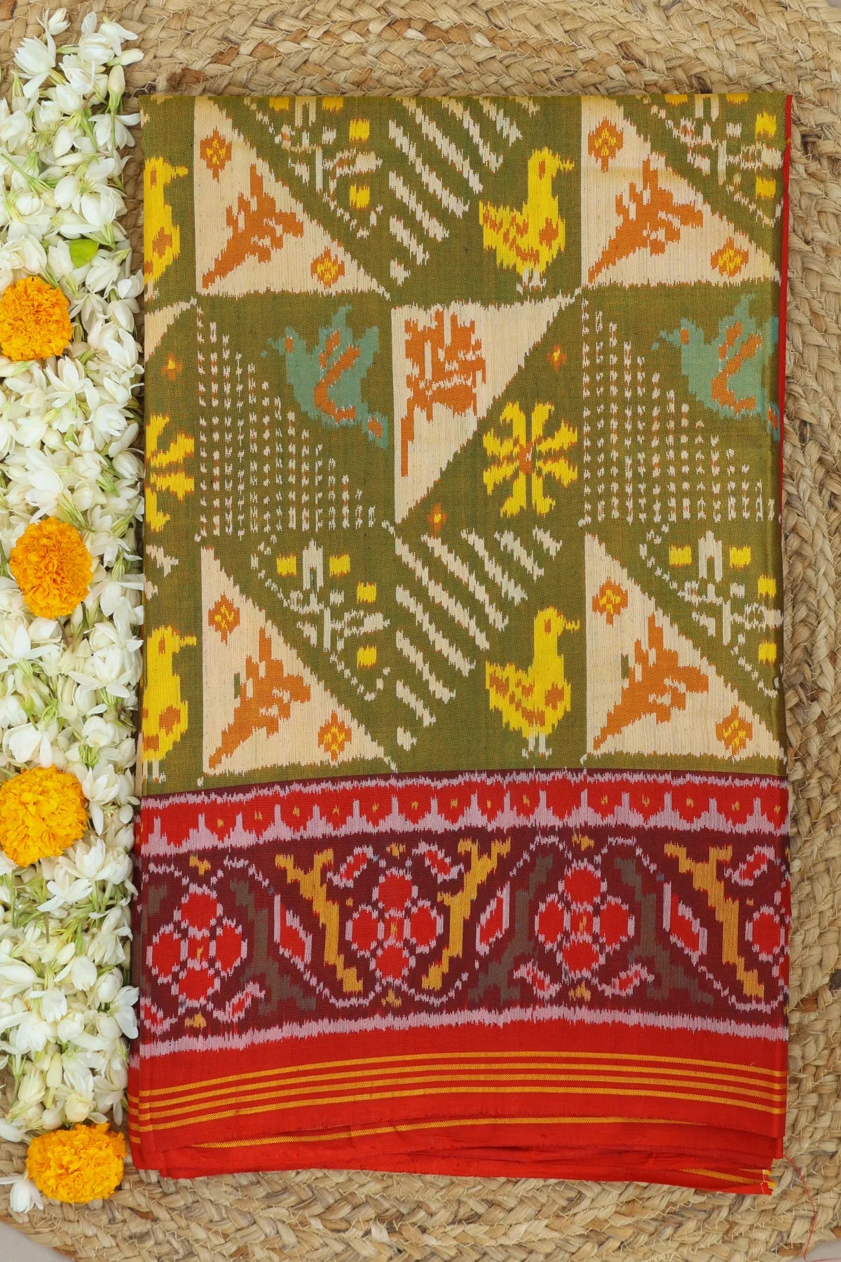Funncy design with motif pallu border traditional design semi double ikat patola saree