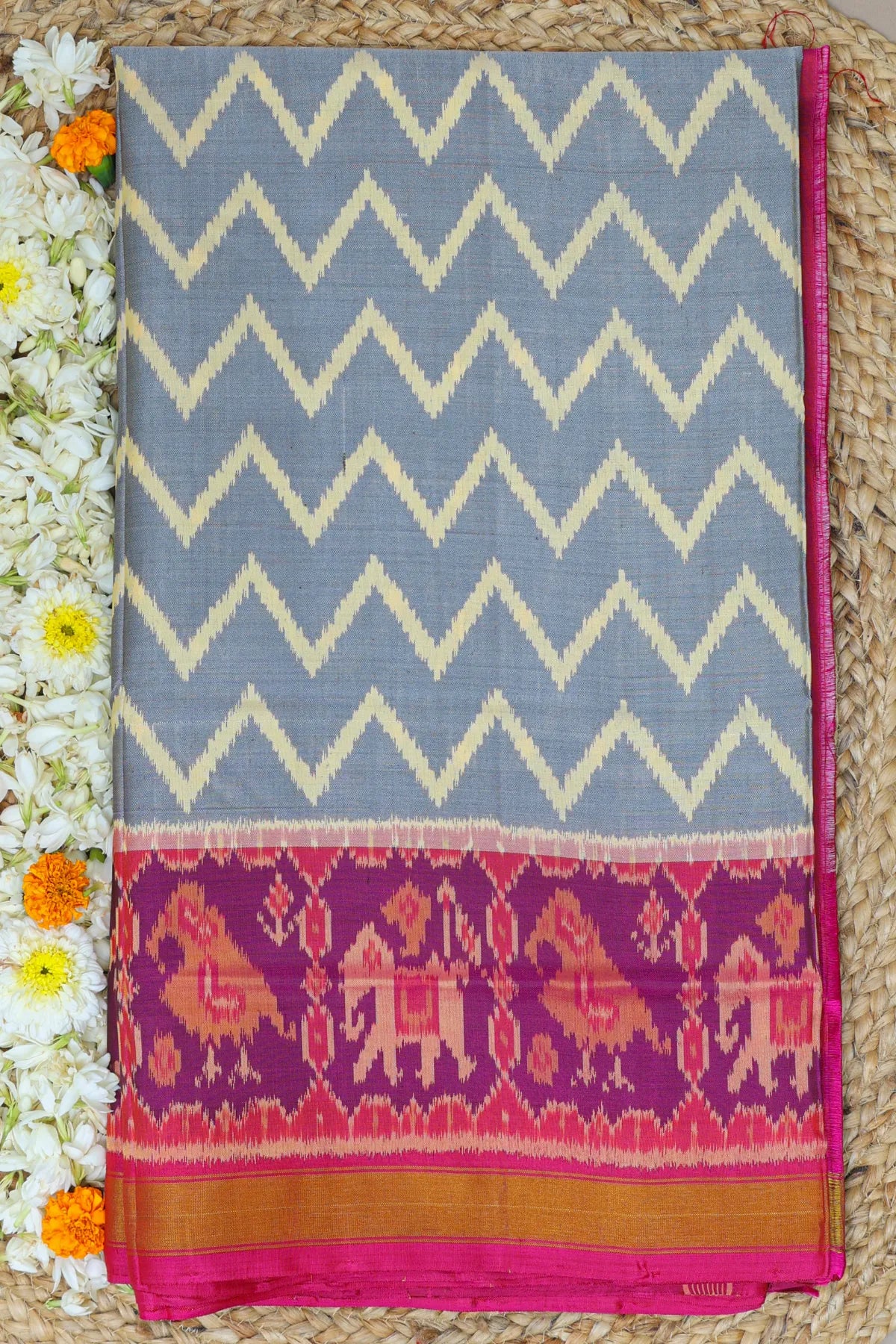 Zig-zag with traditional motifs design border single ikat patola saree