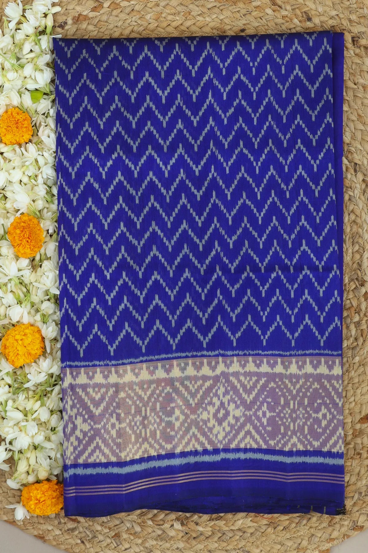 Zig-zag design with tissue border pallu single ikat patola saree