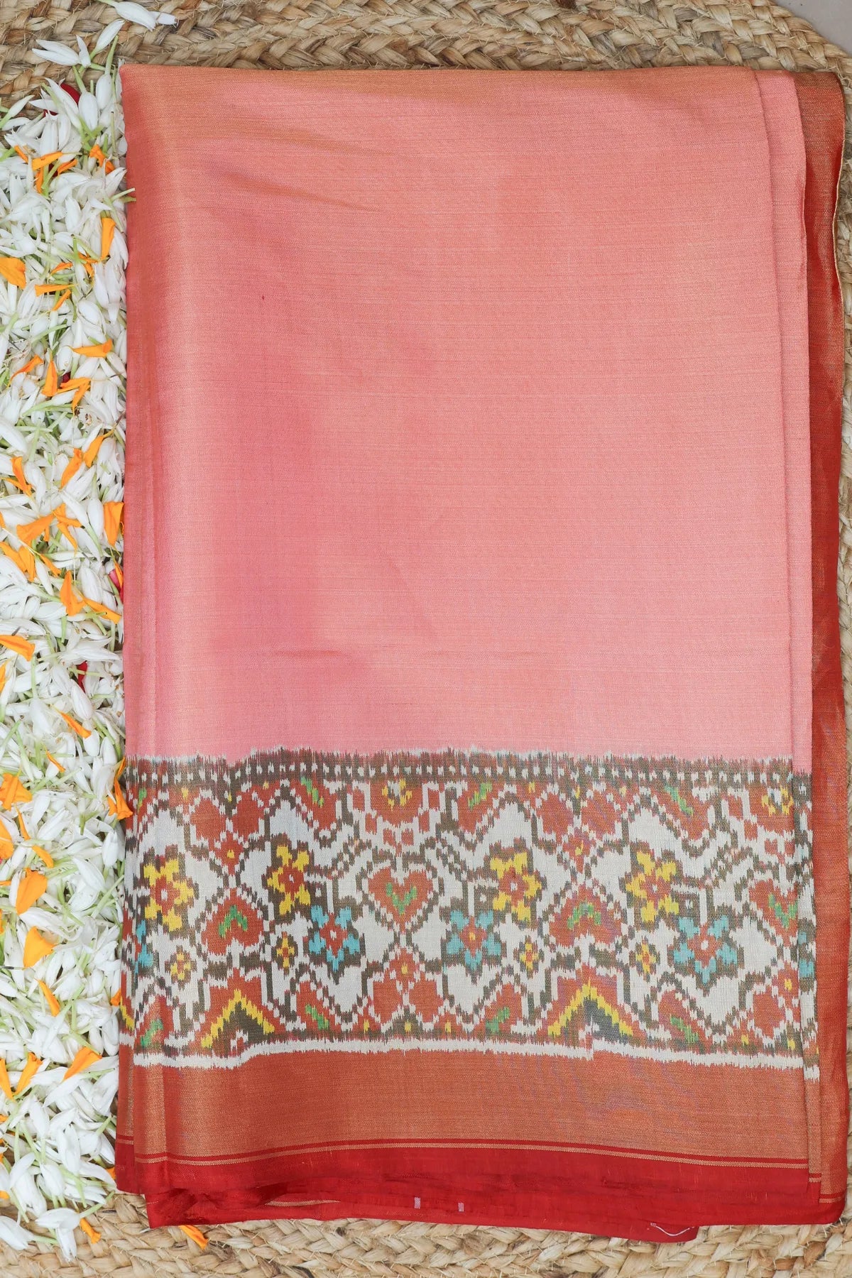 Plain pink with off white navratna manek chowk border tissue patola saree