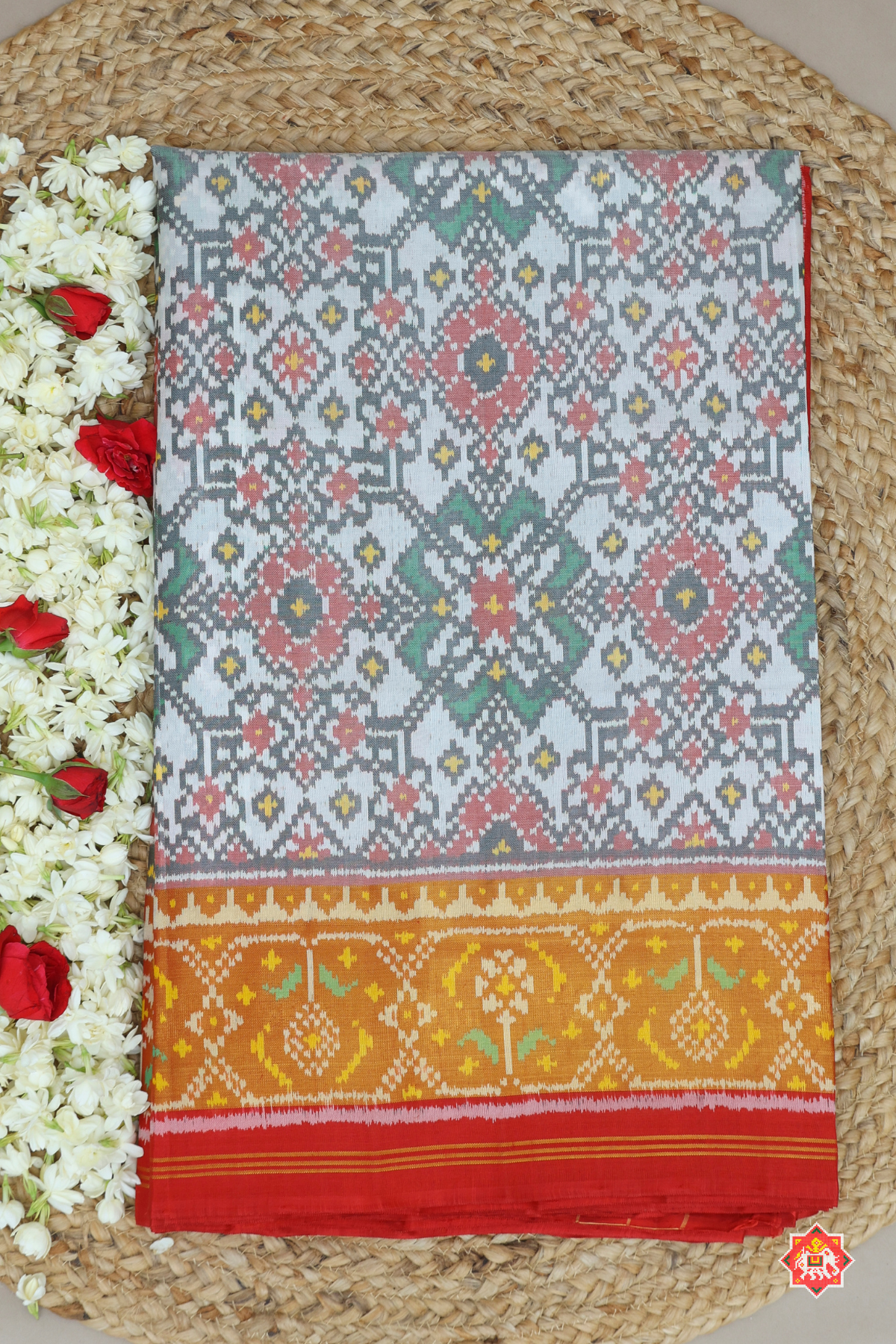Traditional navratna design with minakari work tissue border single ikat patola