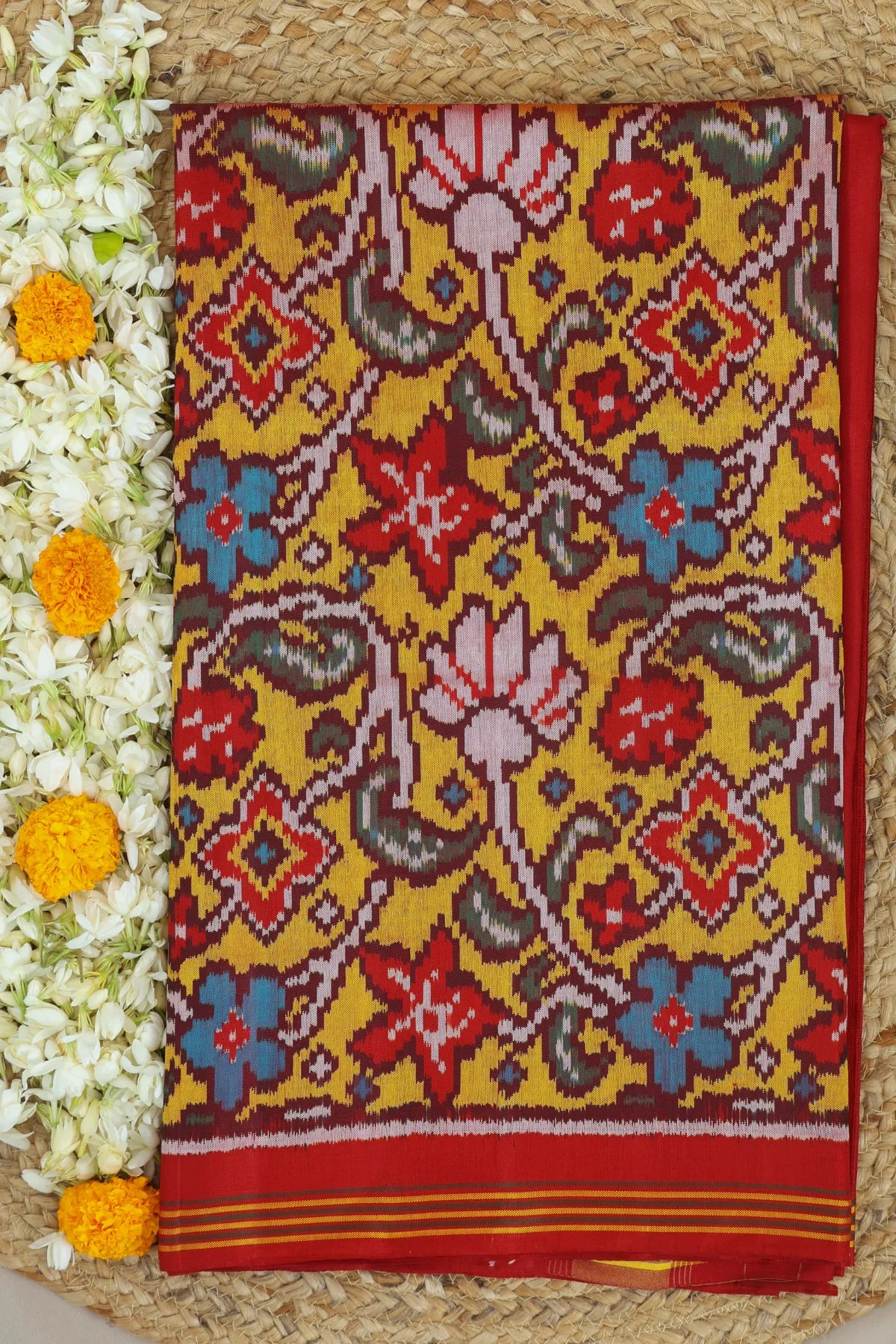 Rangoli design with lines border traditional design  pallu semi double ikat patola saree
