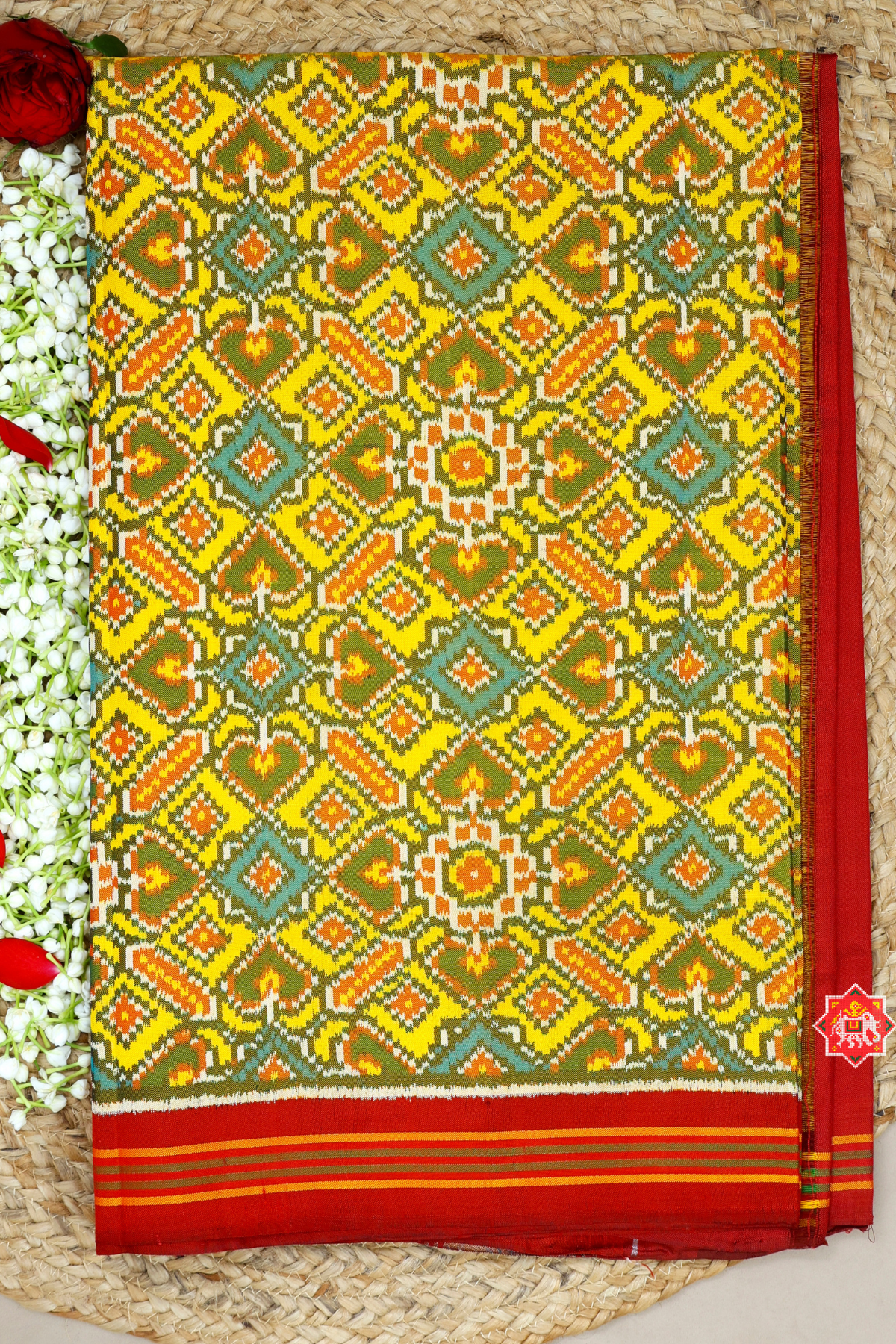 Paan chanda design with minakari work semi double ikat patola saree