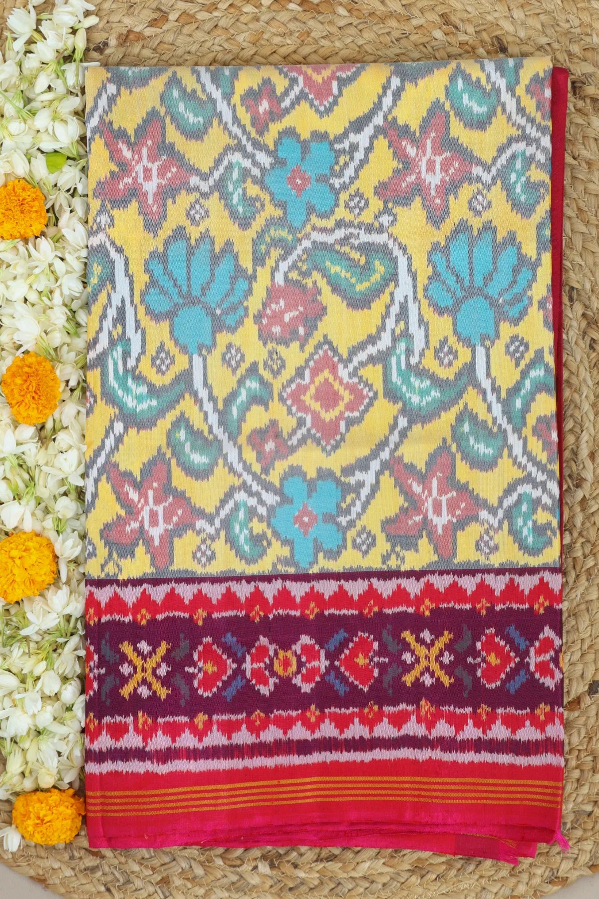 Rangoli design with pallu border contras semi double ikat patola saree