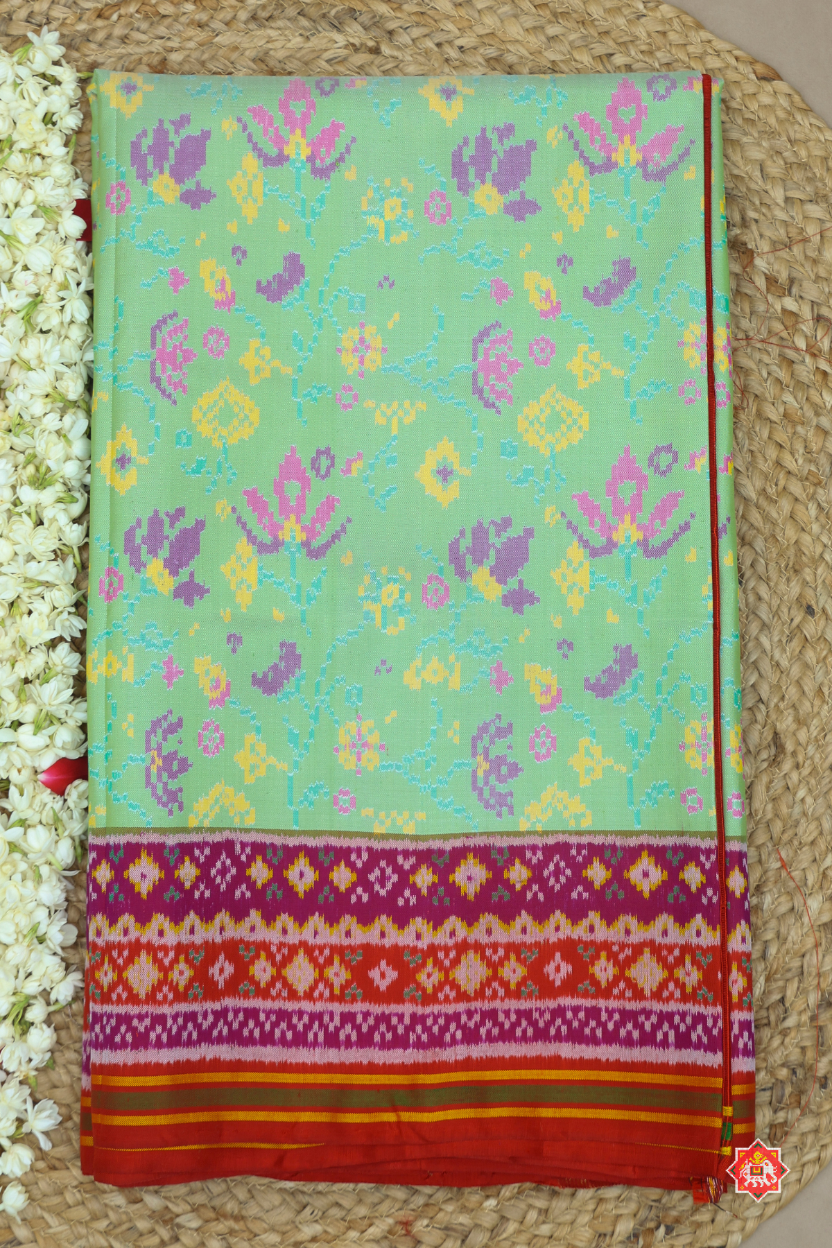 Masterpiece white flowers vel design semi double ikat patola saree