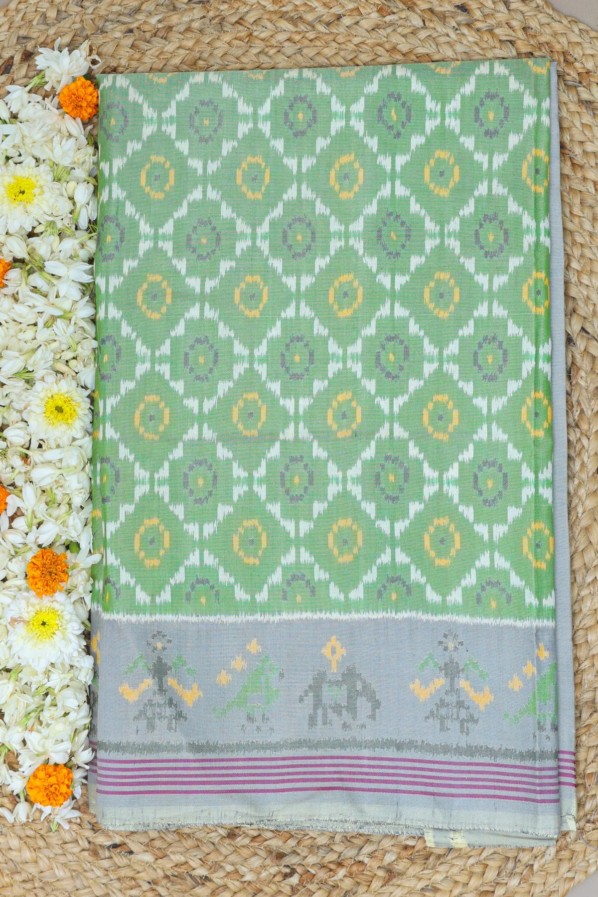 Fancy flower design with motifs design pallu border semi double ikat patola saree