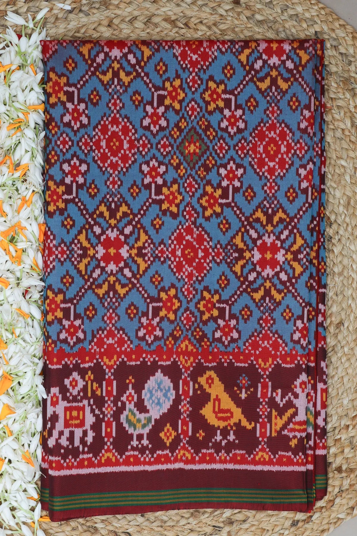 Traditional navratna design with pallu border motif design  semi double ikat patola saree