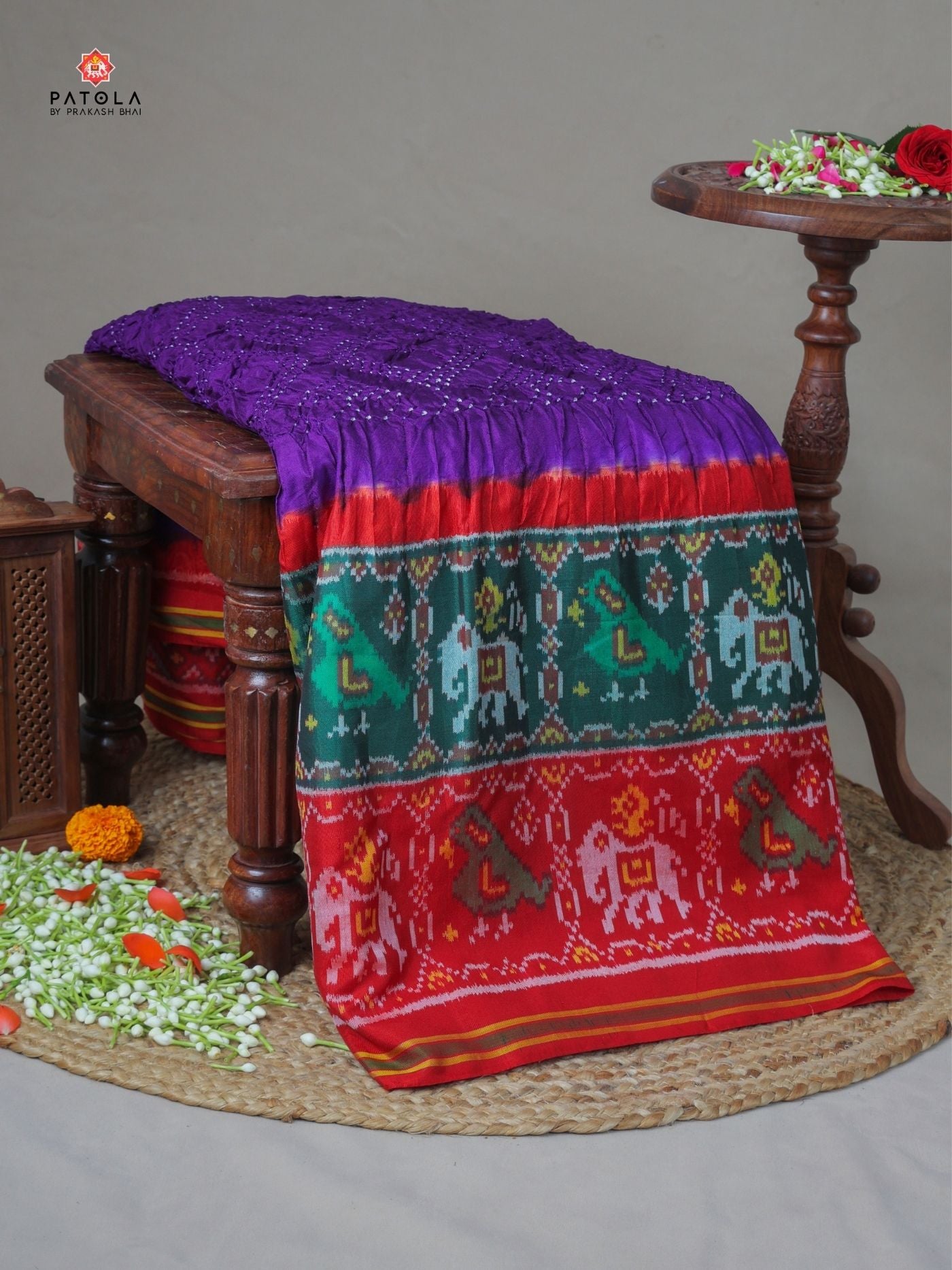 Two colors border with small bandhej patola saree