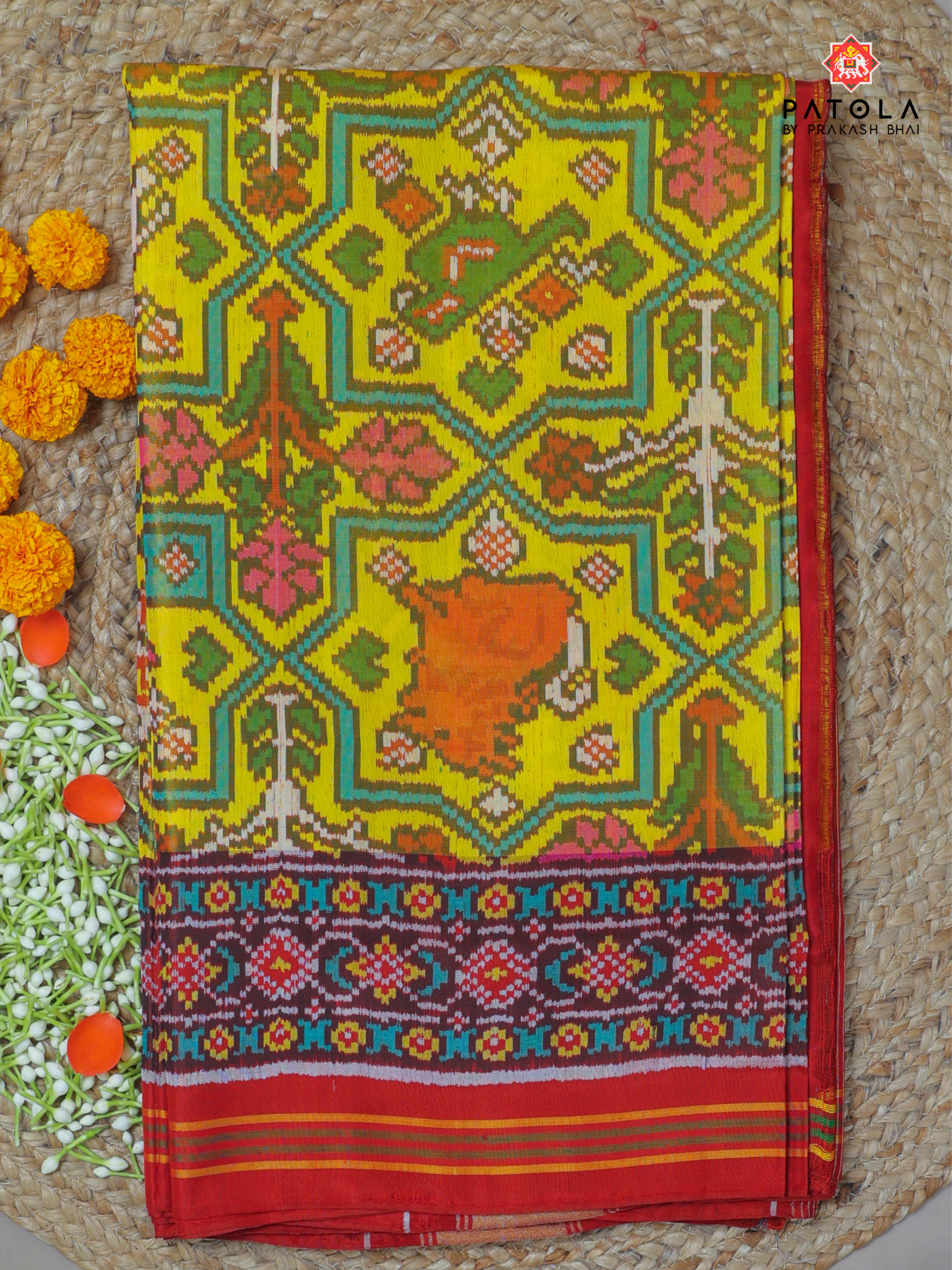 Flowers vel with animal desig semi double ikat patola saree