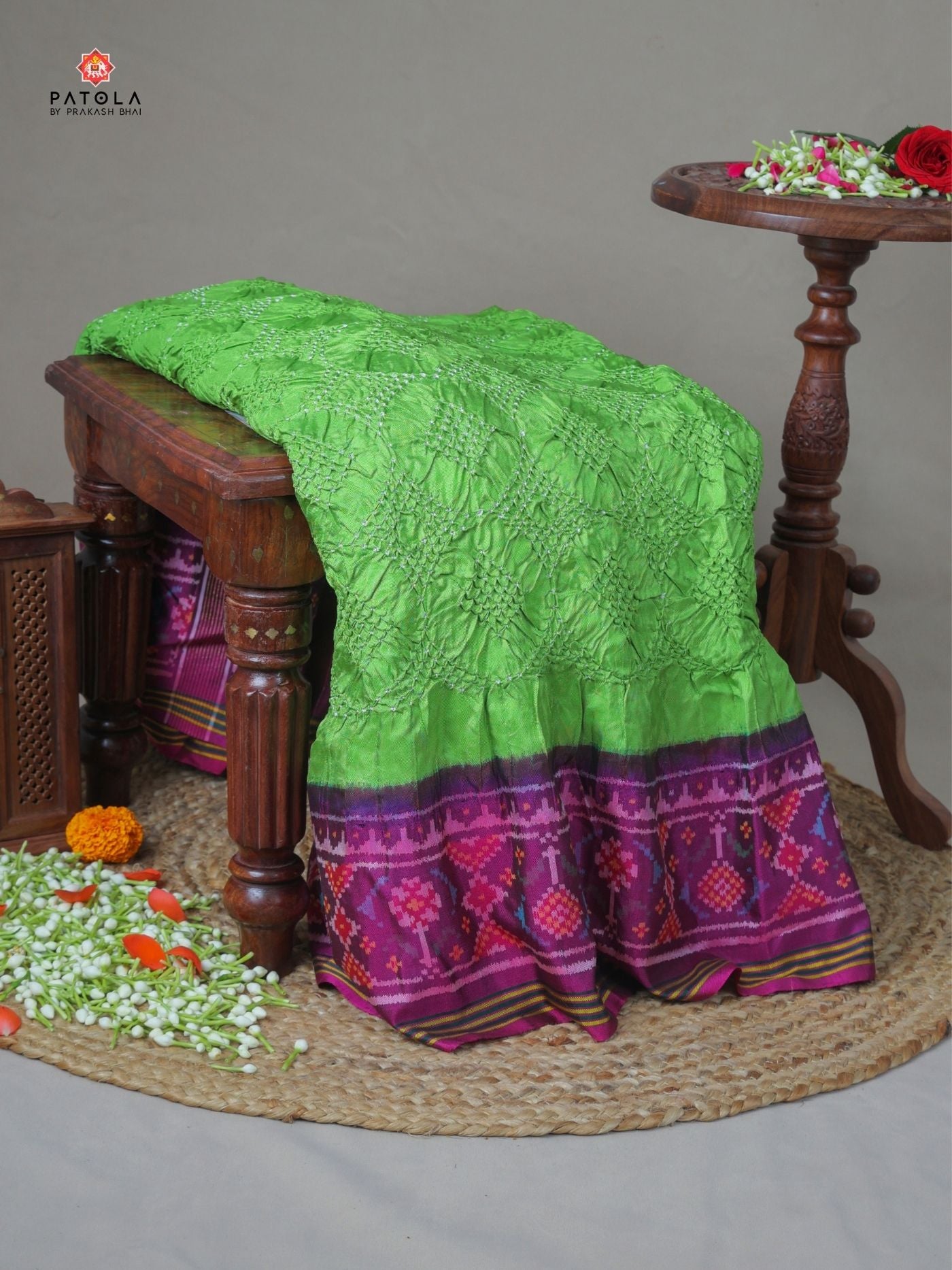 Ghughroo border with small bandhej patola saree Blouse design