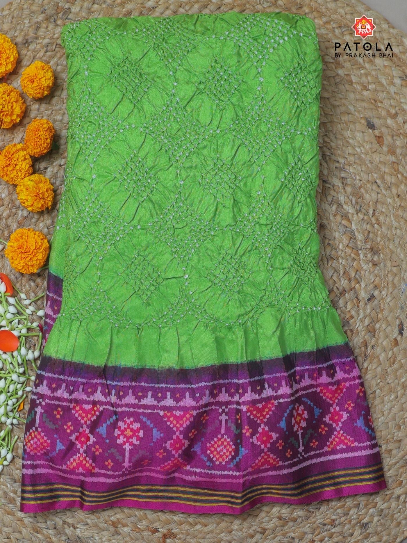 Ghughroo border with small bandhej patola saree Blouse design