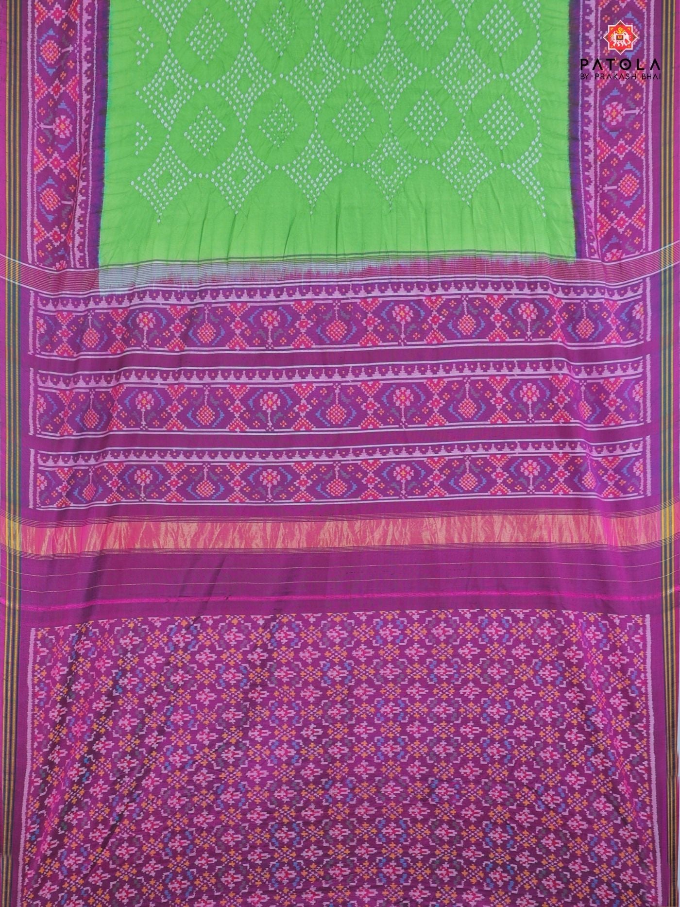 Ghughroo border with small bandhej patola saree Blouse design
