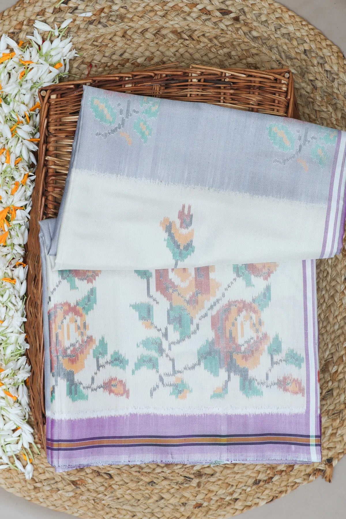 Masterpiece suct border with flower design pallu semi double ikat patola saree