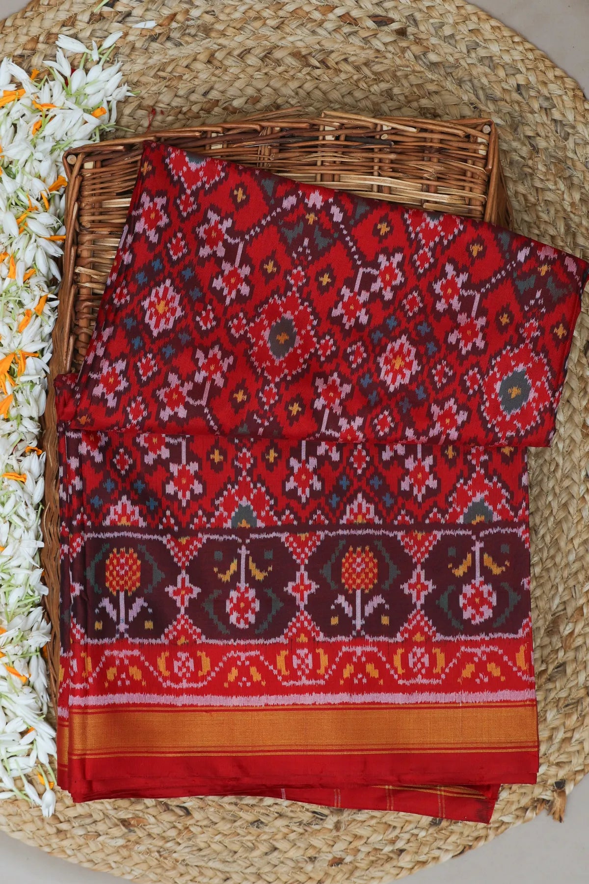 Traditional navratna design small tissue border single ikat patola saree