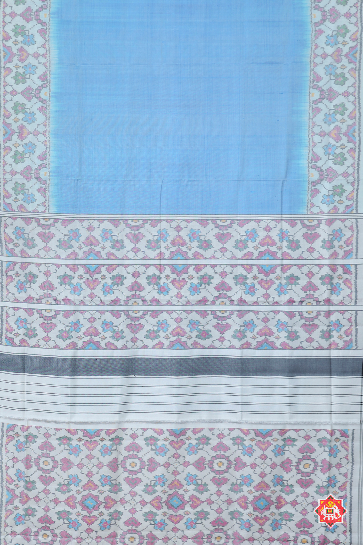 Plain sky with off-white navratna manek chowk border & blouse patola design semi double ikat patola saree