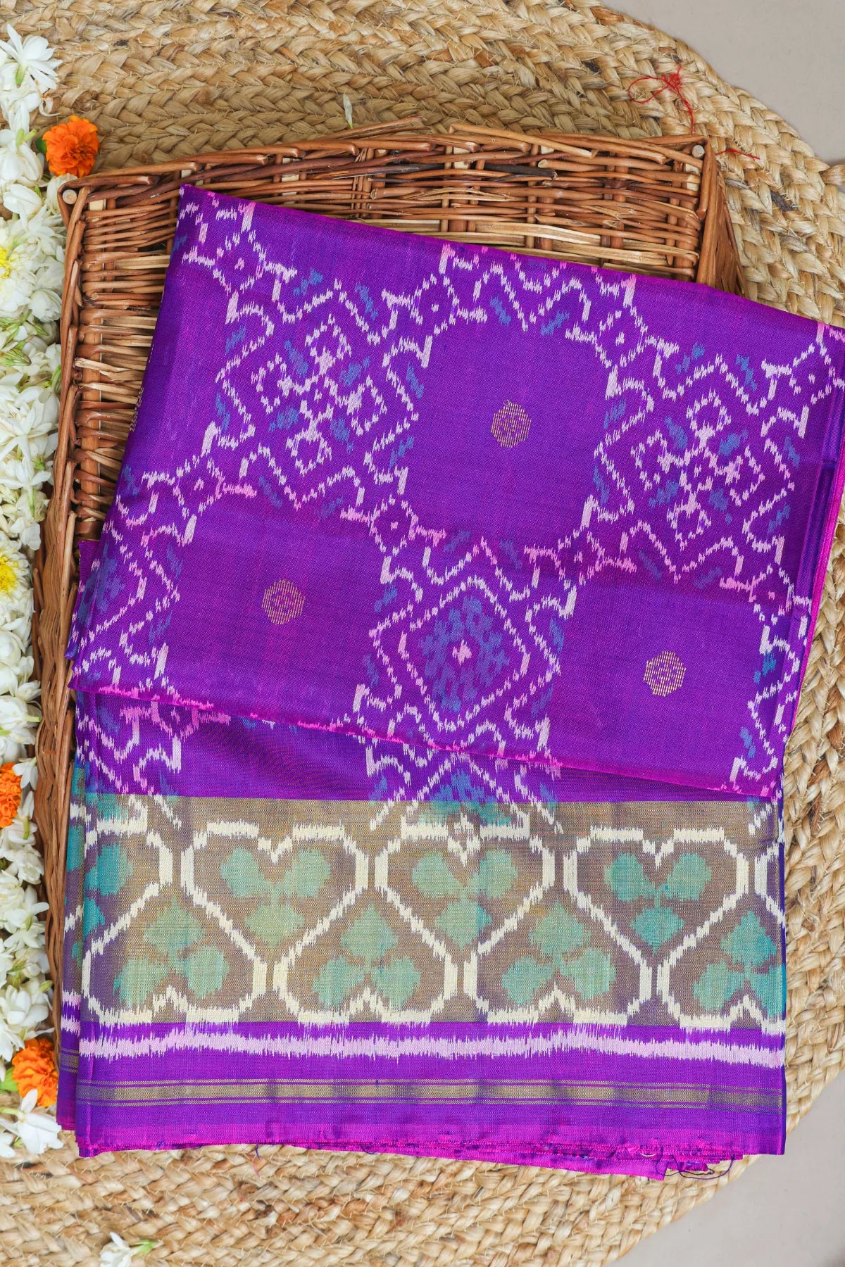 Zig-zag with traditional motifs design border single ikat patola saree