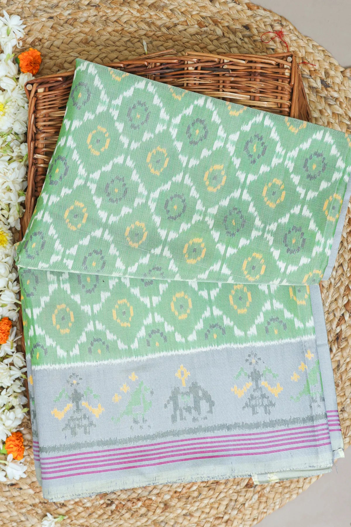 Fancy flower design with motifs design pallu border semi double ikat patola saree