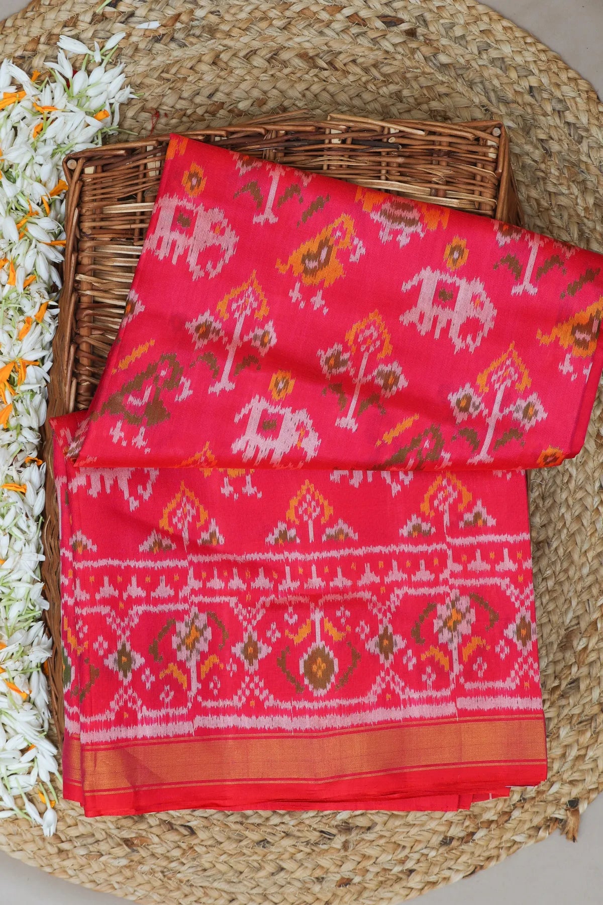 Traditional motif design with small tissue border single ikat patola saree