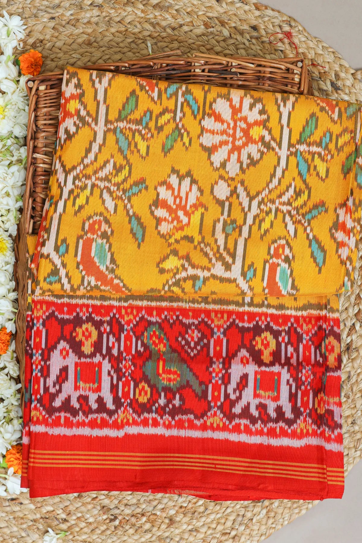 Fancy flower design with motifs design pallu border traditional design semi double ikat patola saree