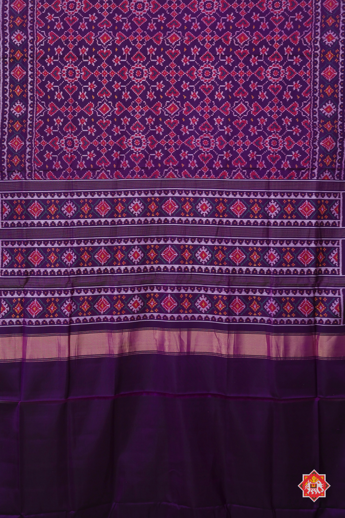 Traditional paan chnada design with minakari work semi double ikat patola saree