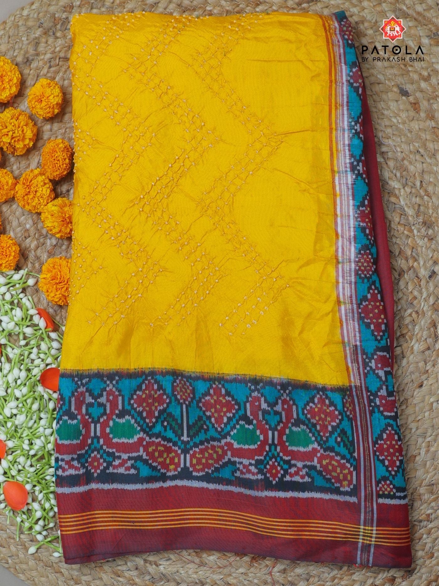 Peacock border with small bandhej patola saree blouse design