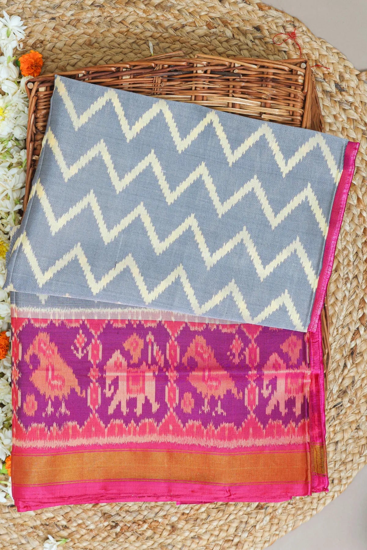 Zig-zag with traditional motifs design border single ikat patola saree