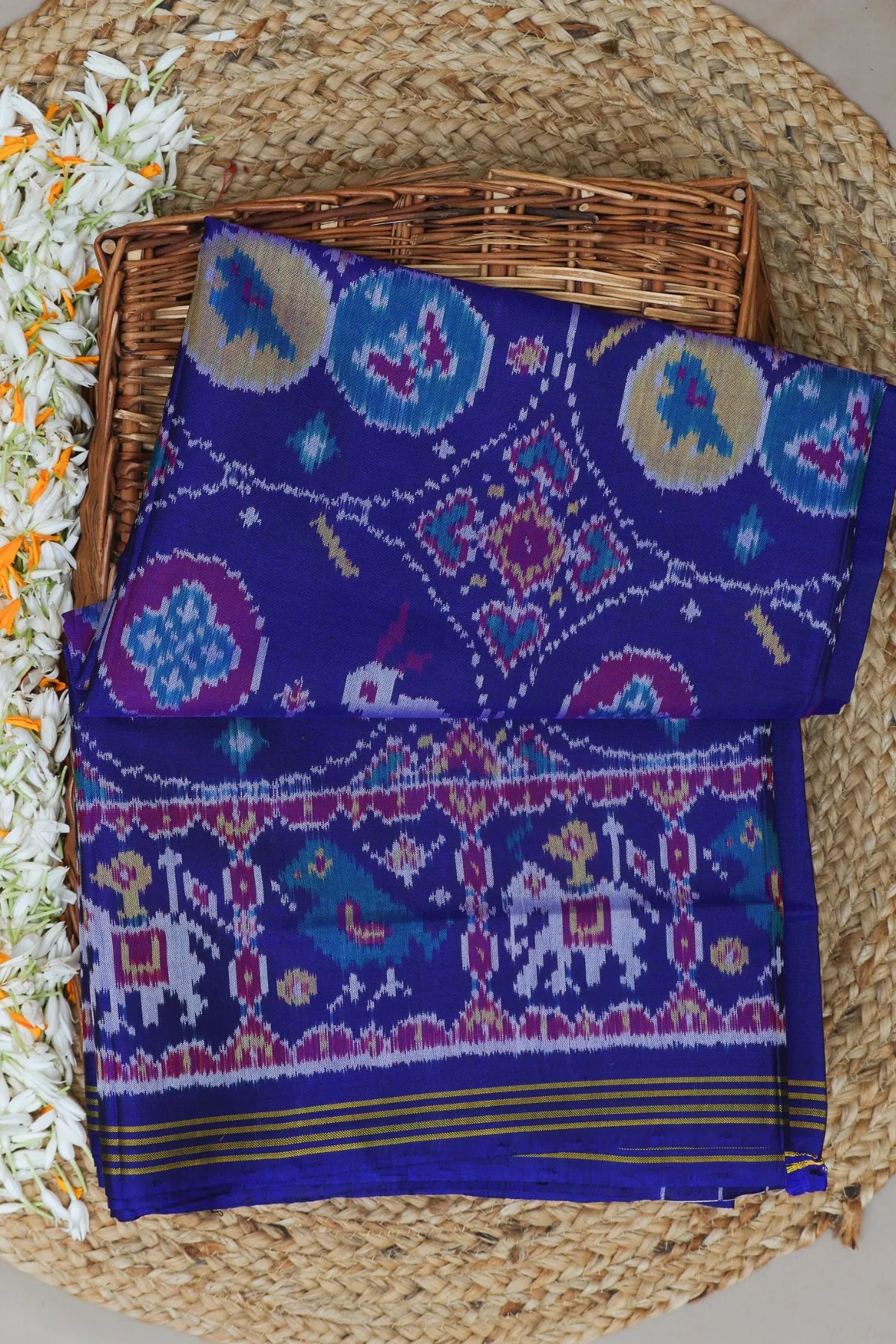 Chhabdi with motif design plain blue color semi double ikat patola saree
