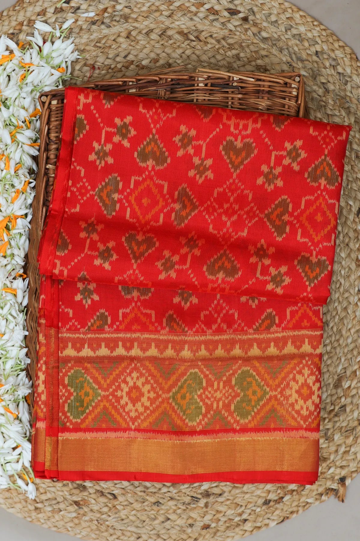 Paan chanda design with tissue border single ikat patola saree