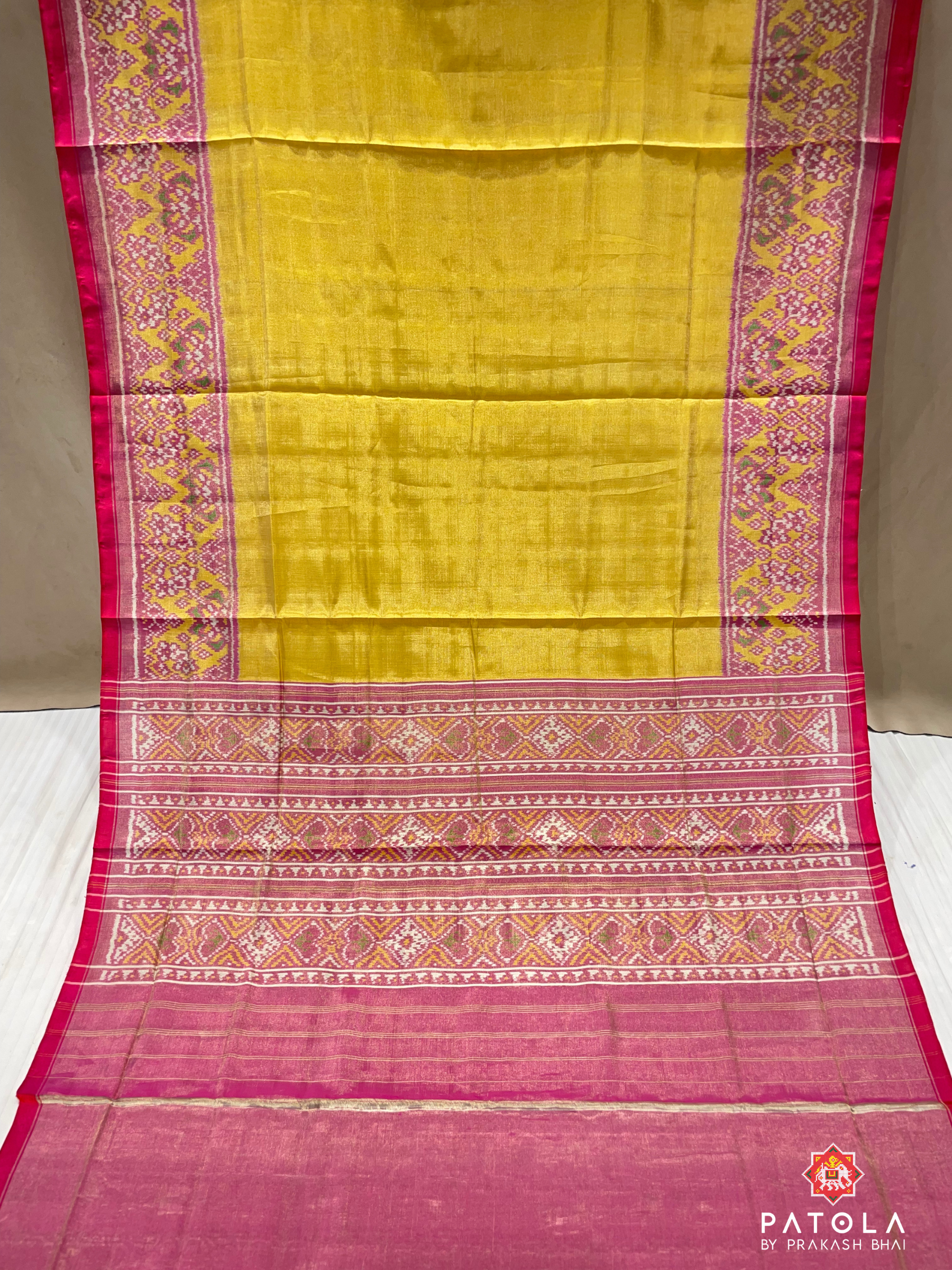 Plain Yellow With Navratna Border Tissue Patola Saree