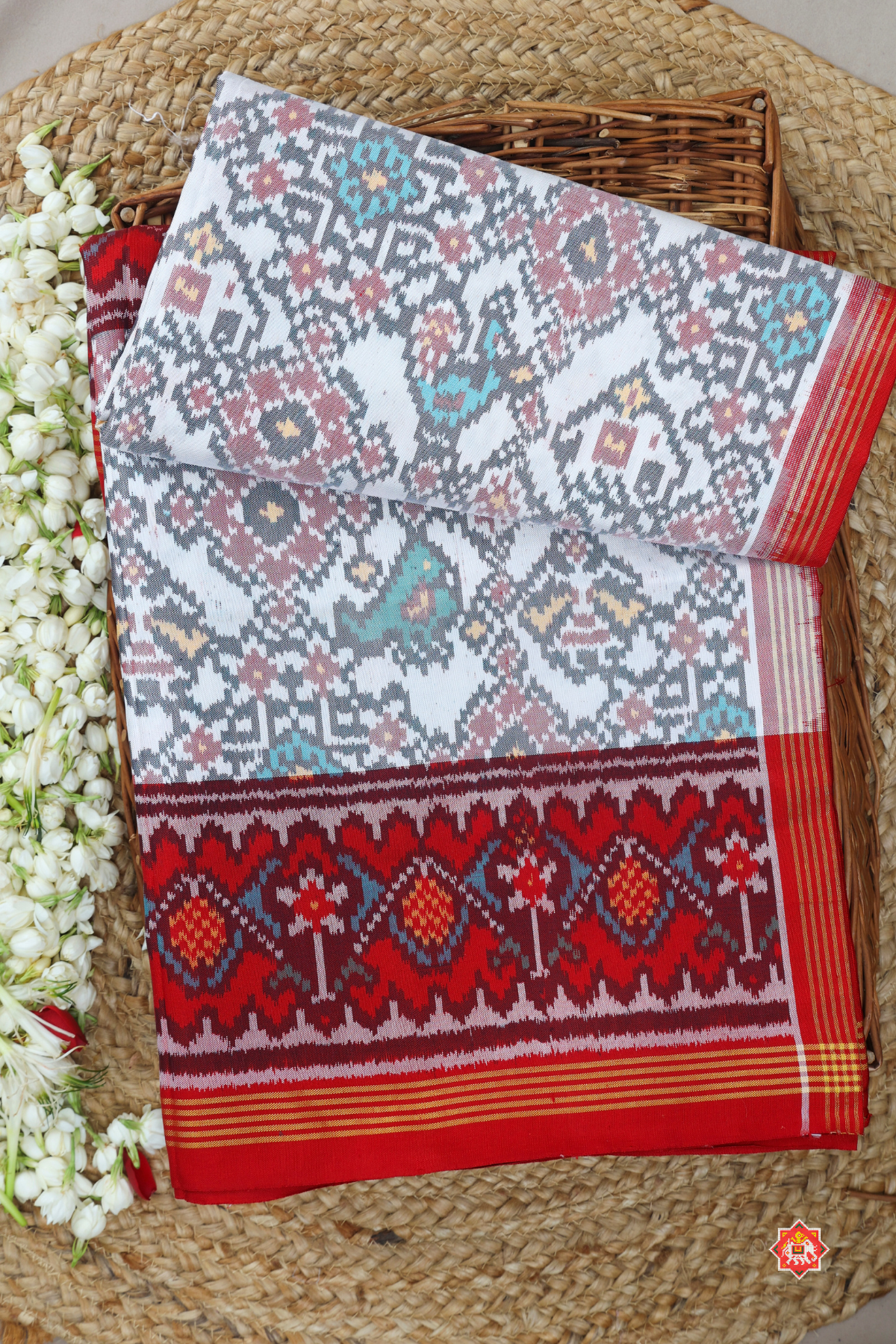 Traditional navratn design with small motif design semi double ikat patola saree