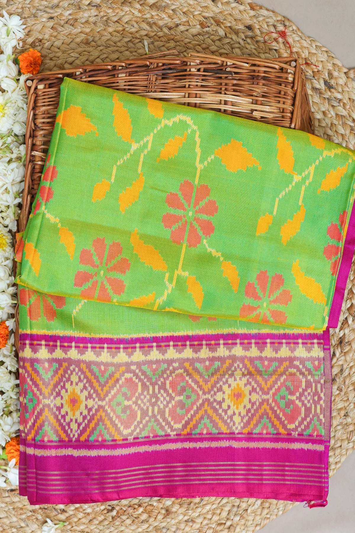 Rangoli design with pallu border contras single ikat patola saree