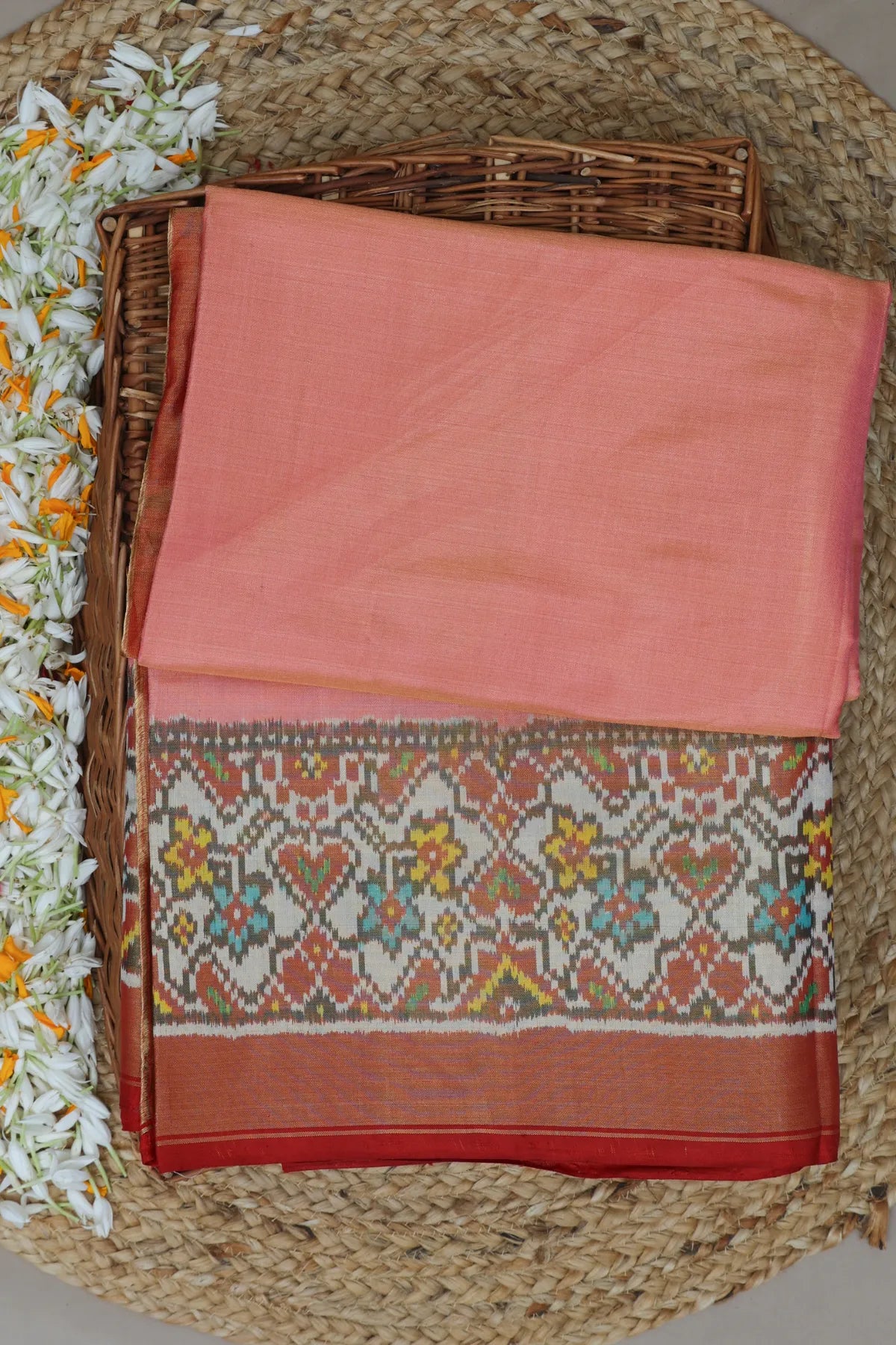 Plain pink with off white navratna manek chowk border tissue patola saree