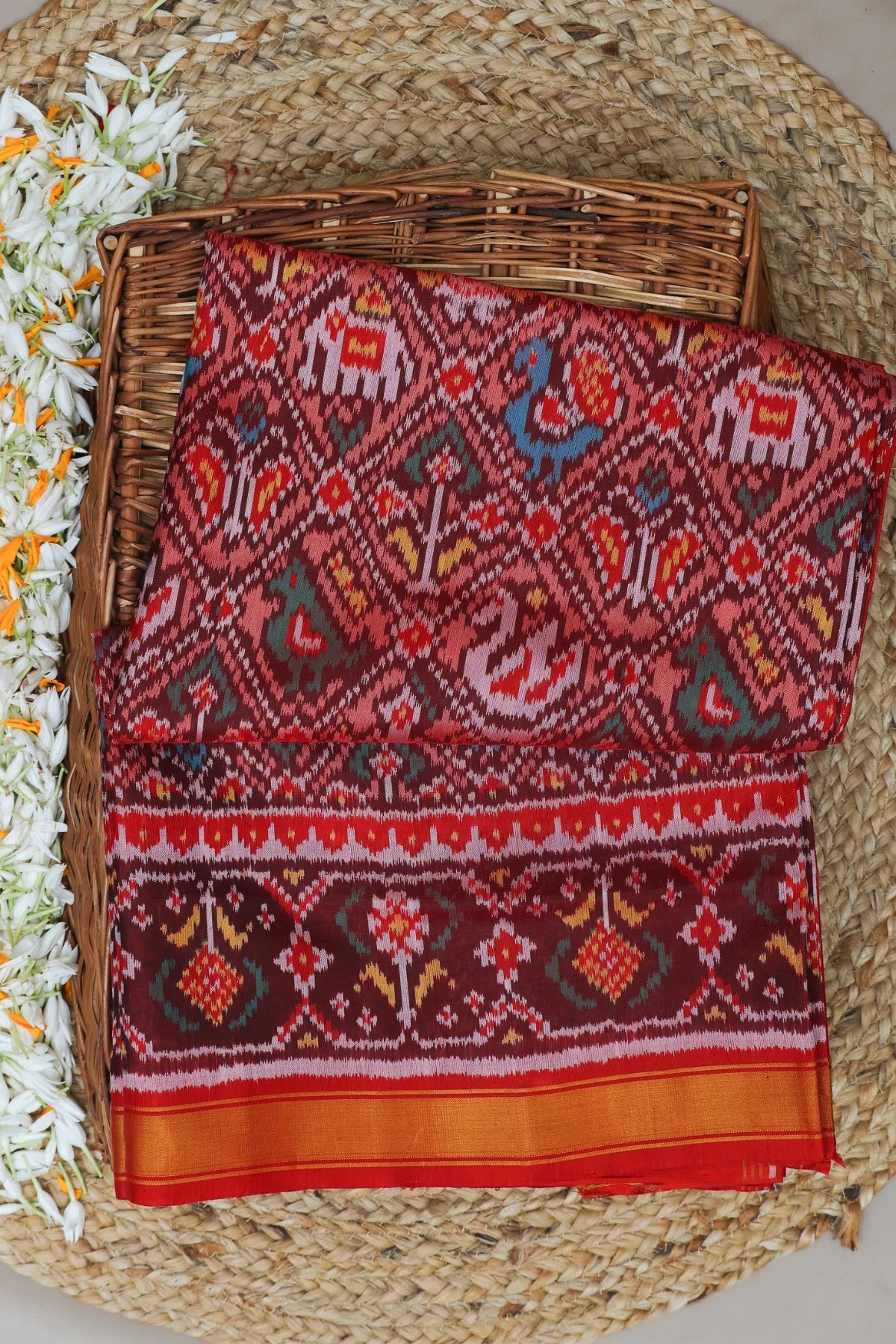 Traditional nari kunjar design with ghughroo border single ikat patola saree