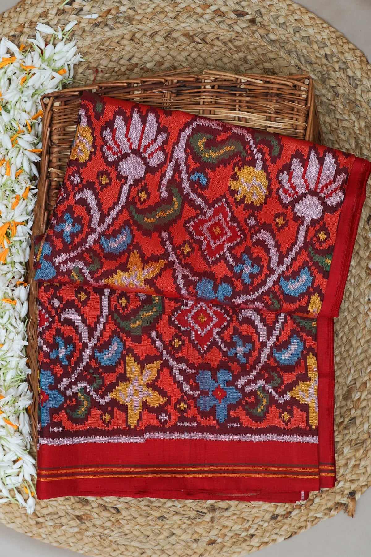 Masterpiece rangoli design with lines border traditional pallu design semi double ikat patola saree