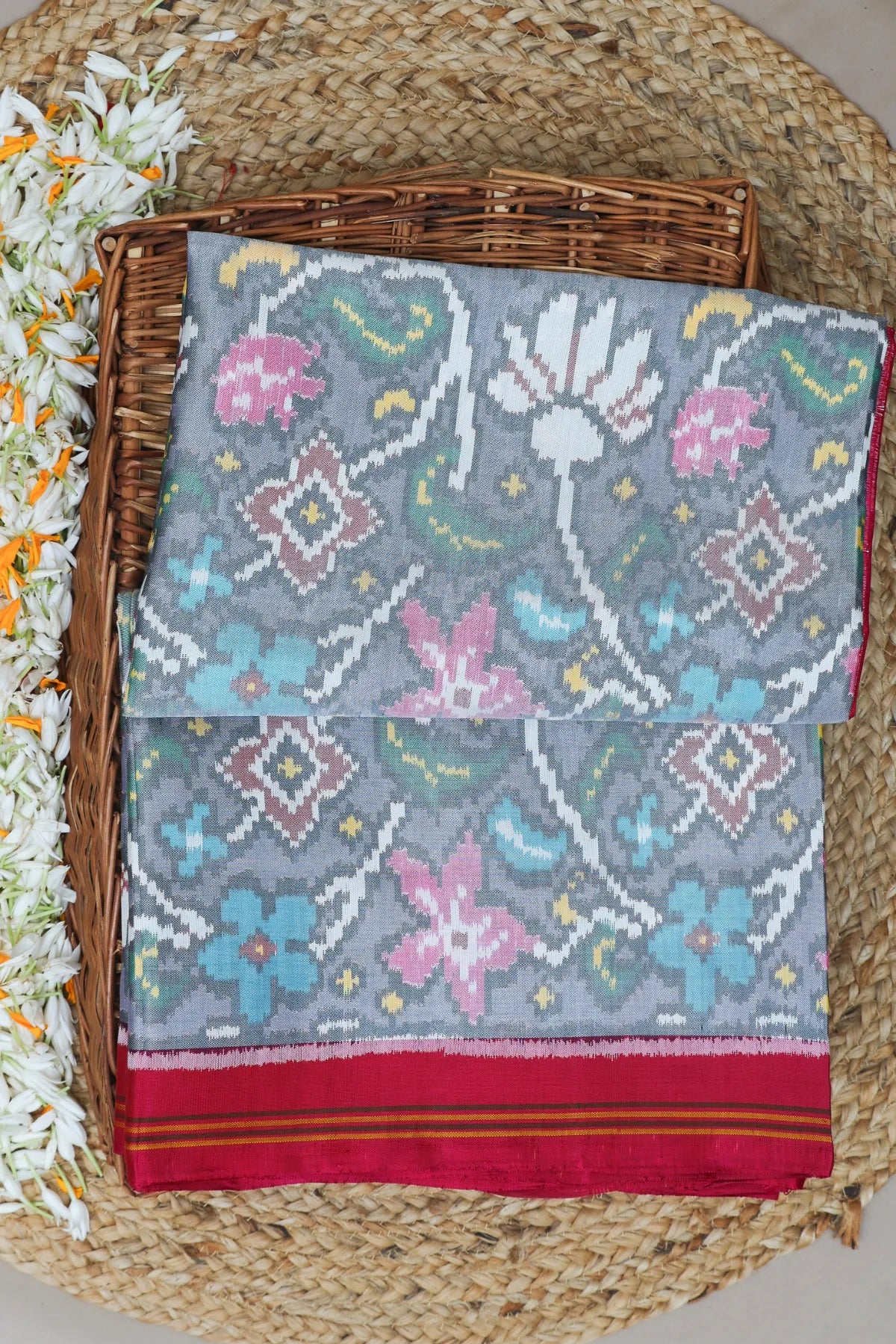 Masterpiece rangoli design with lines border traditional pallu design semi double ikat patola saree