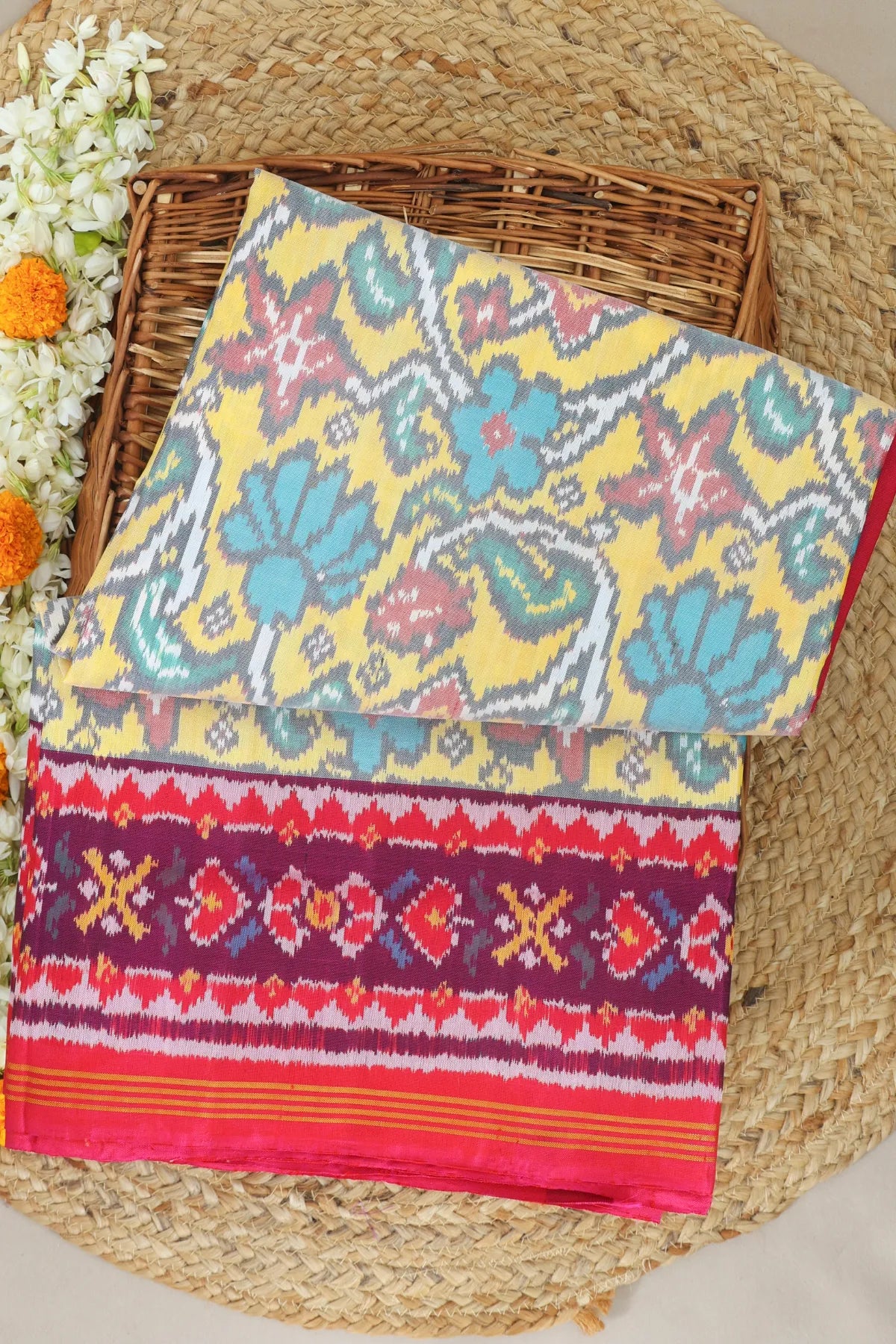 Rangoli design with pallu border contras semi double ikat patola saree