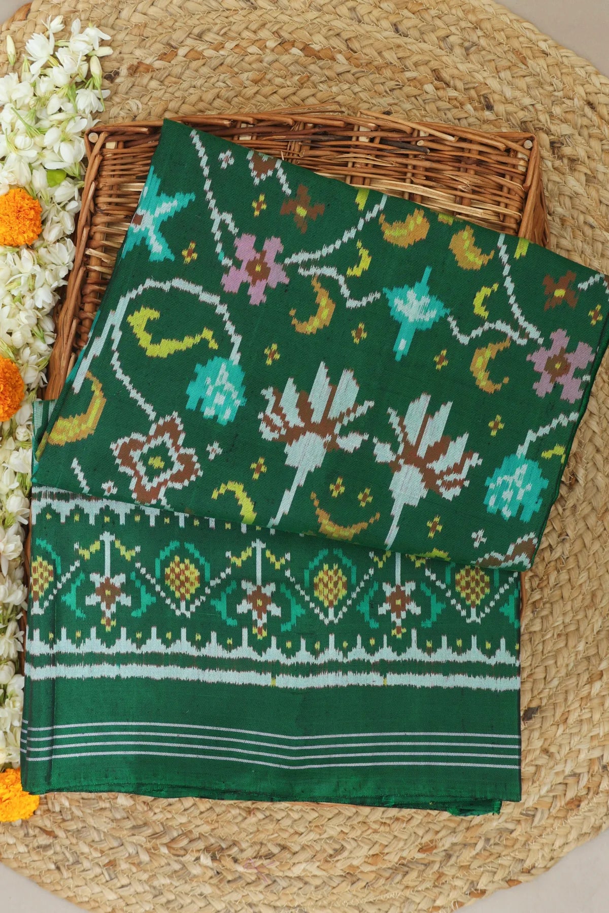 Rangoli design with pallu border traditional semi double ikat patola saree