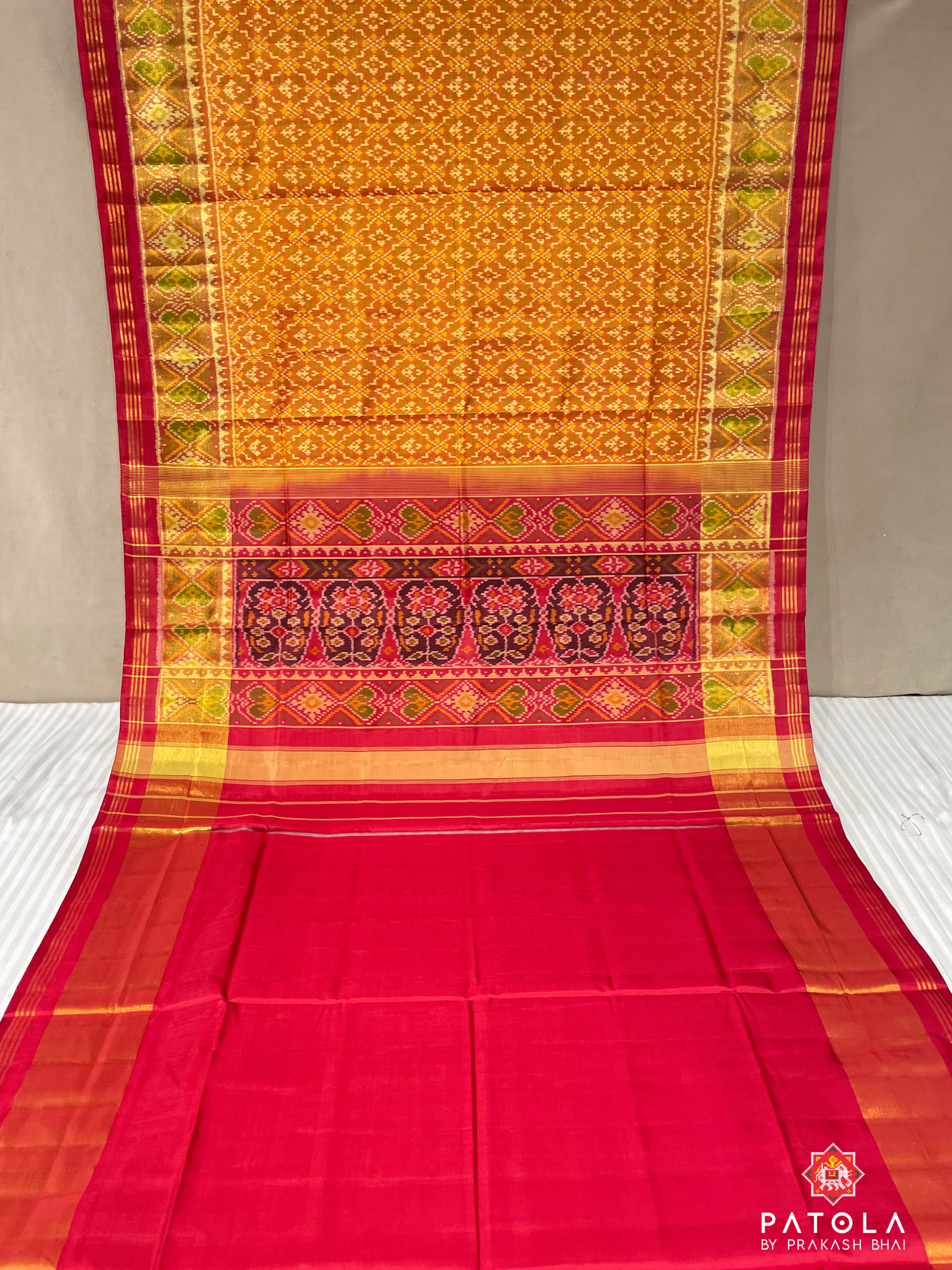Traditional Orange Button Phool Designer Single Ikat Patola Saree