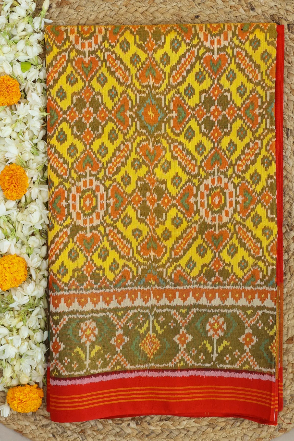 Minakari work & manek chowk design with ghughroo pallu border single ikat patola saree