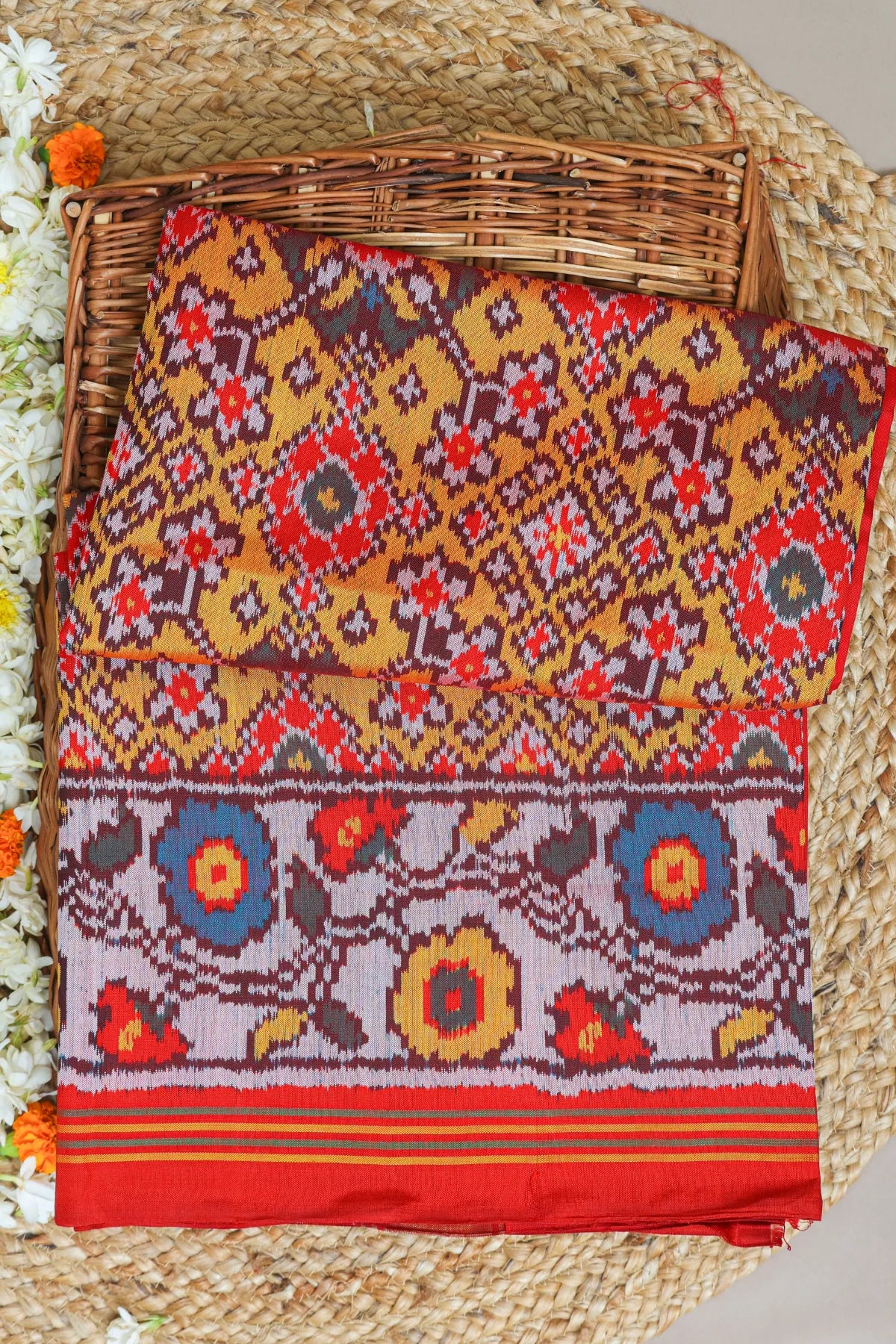 Navratna design with flowers border semi double ikat patola saree
