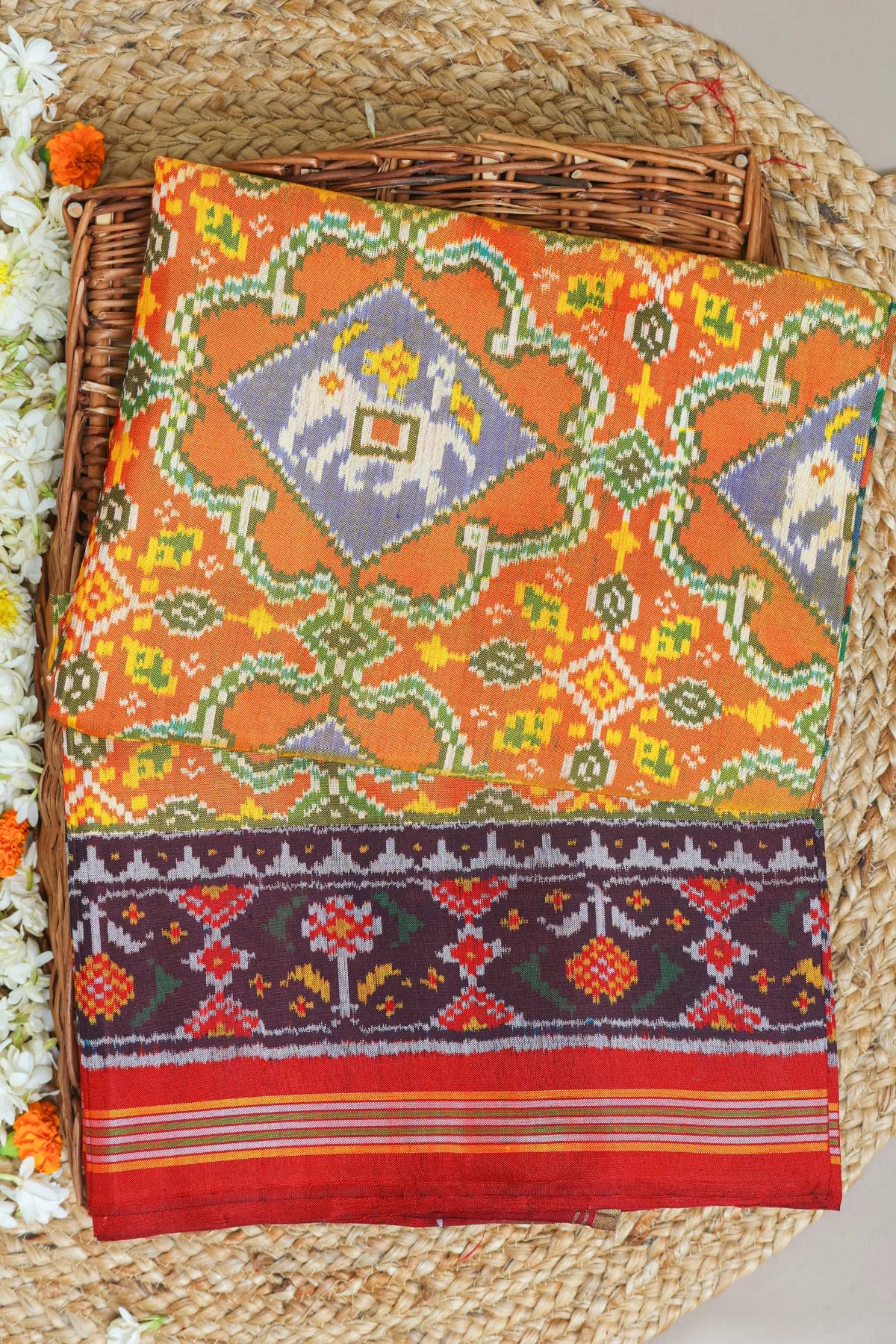 Rangoli design with elephant & pallu border ghughroo design semi double ikat patola saree